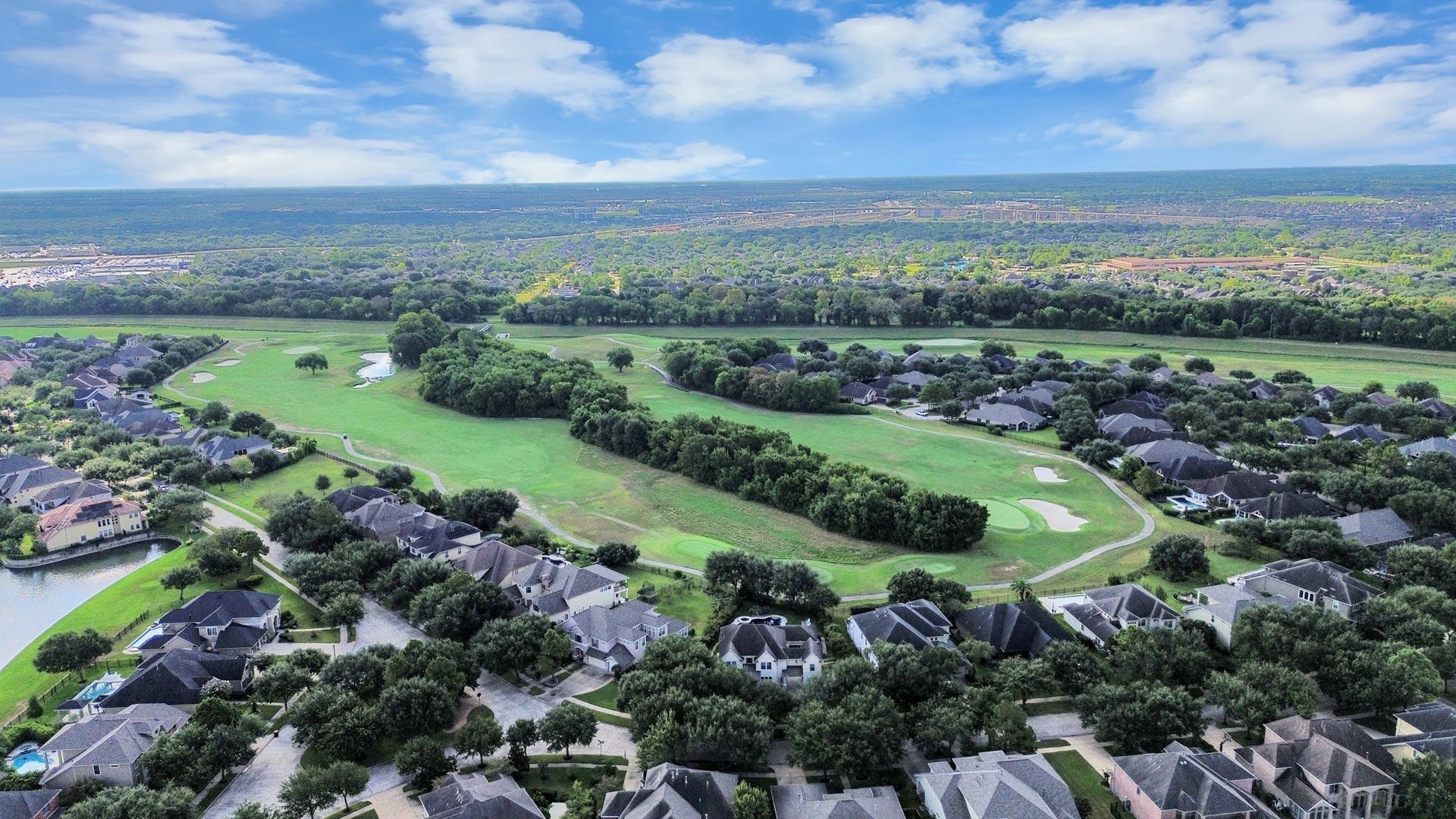 Nestled in a picturesque neighborhood, this home offers breathtaking views of a lush golf course surrounded by mature trees, providing a serene and luxurious setting.