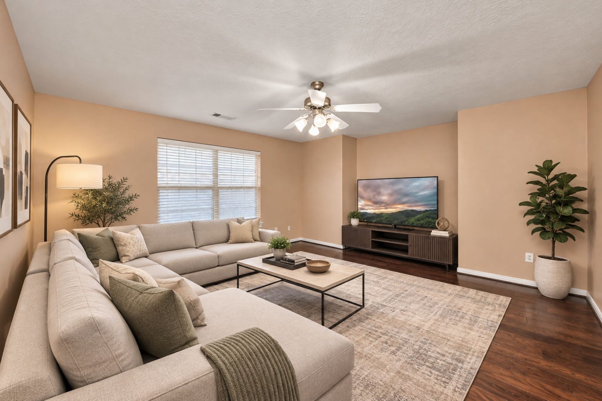 VIRTUAL STAGING
Spacious MEDIA /GAME ROOM with warm tones features a cozy sectional sofa, stylish coffee table, and entertainment center, all under a ceiling fan with ample natural light.