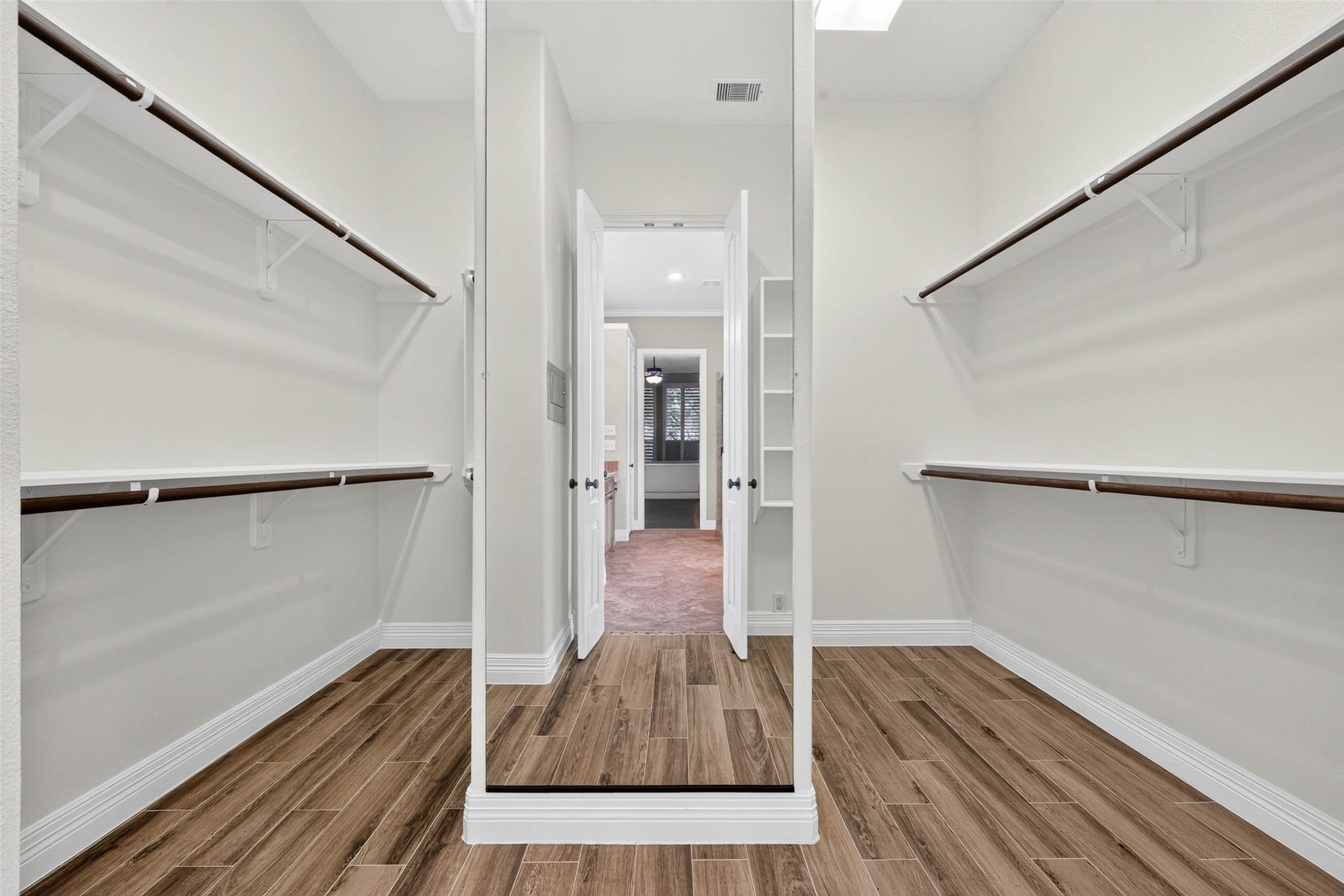 4419 Montcliff Bend Court, Sugar Land, TX 77479 The primary closet features extra space and a large full-length mirror