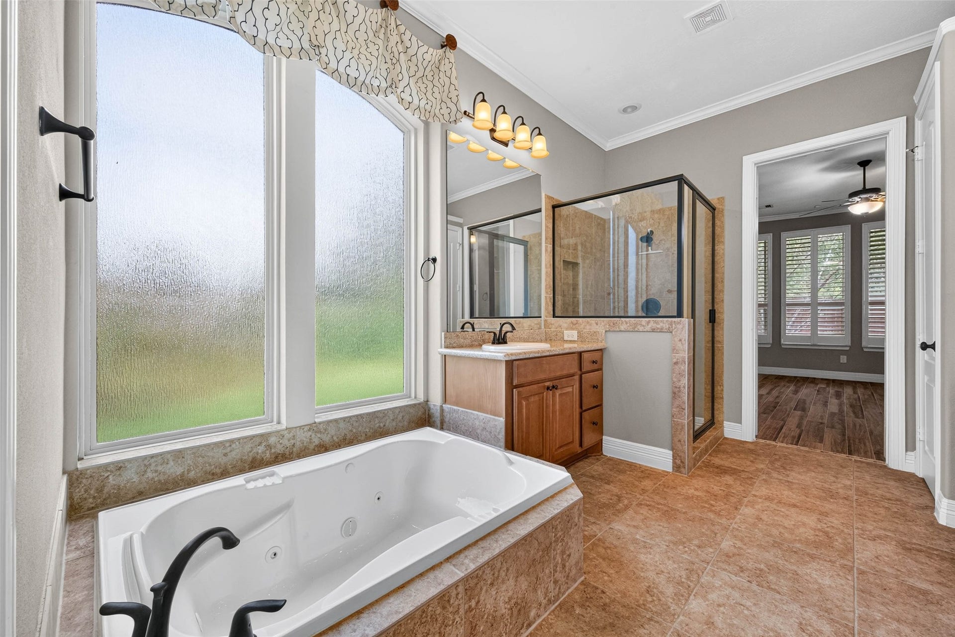 4419 Montcliff Bend Court, Sugar Land, TX 77479 This primary bathroom features a modern soaking tub and a separate walk-in shower