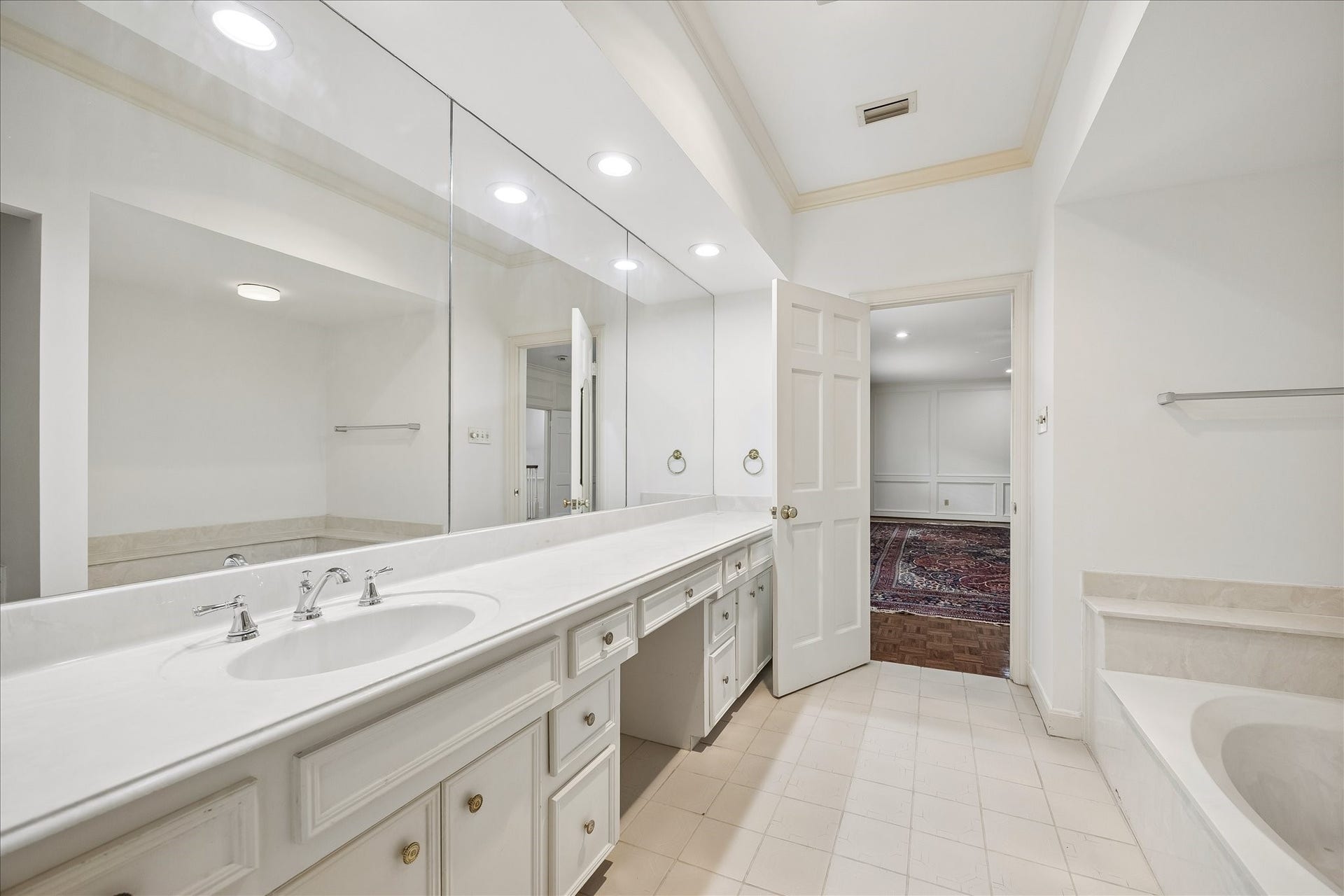 1422 Nantucket Drive, #C, Houston, TX 77057 Primary Bath One features a soaking tub, expansive counter space with seated makeup area and abundant storage.