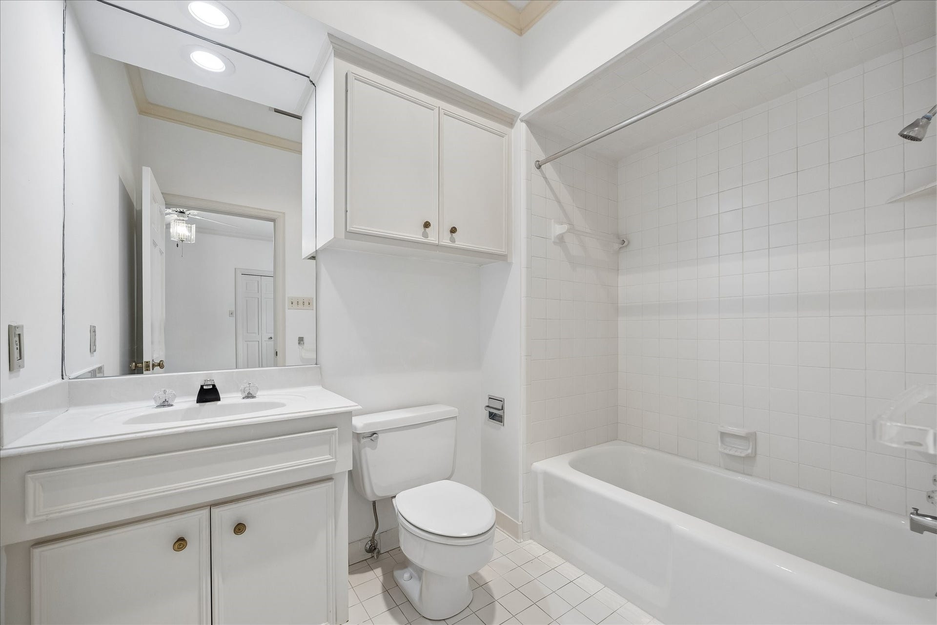 1422 Nantucket Drive, #C, Houston, TX 77057 En-suite bath with tub/shower combination and built-in storage.