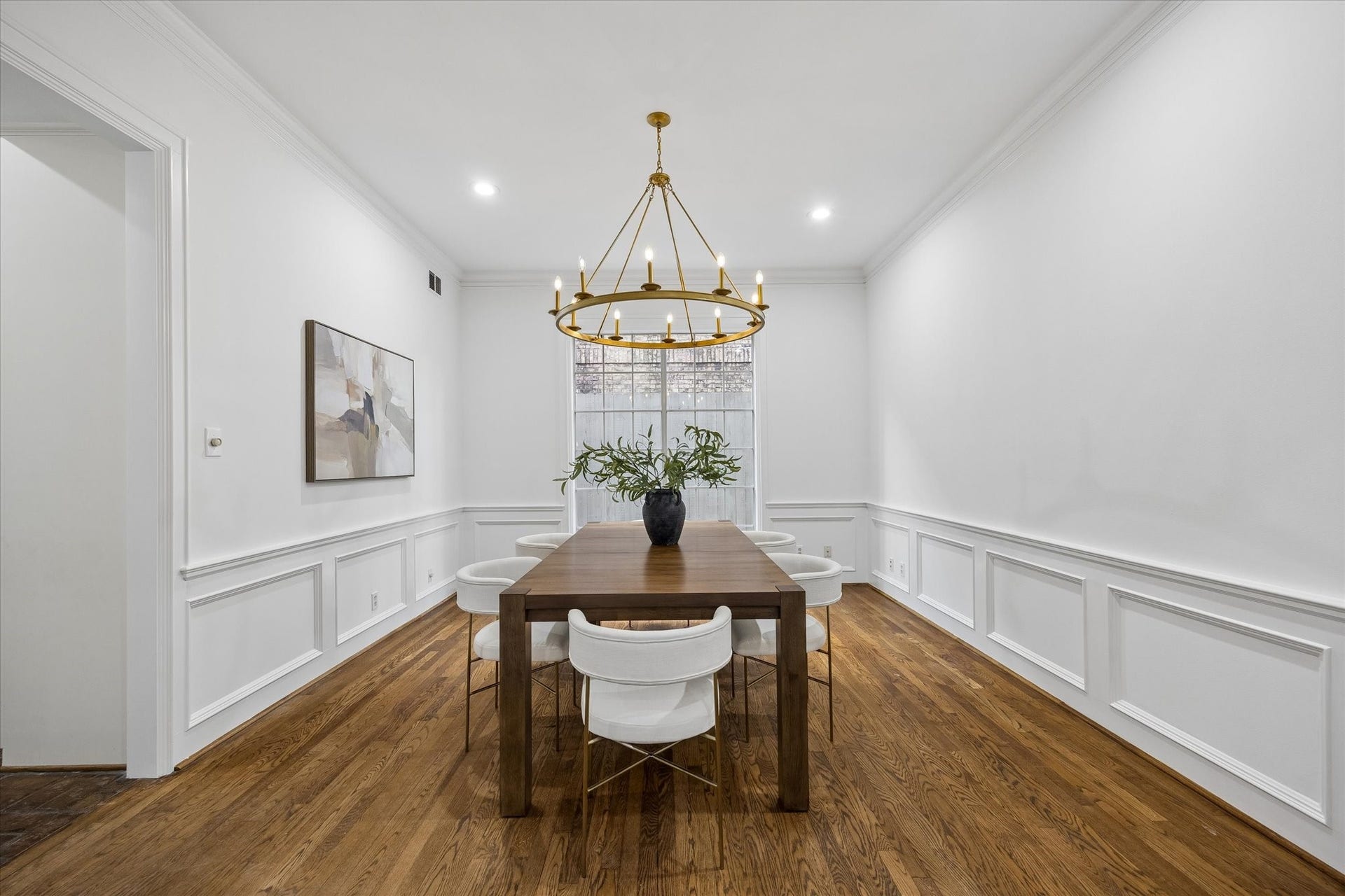 1422 Nantucket Drive, #C, Houston, TX 77057 Abundant natural light fills the formal dining room through a large floor-to-ceiling window, with direct access to the kitchen.