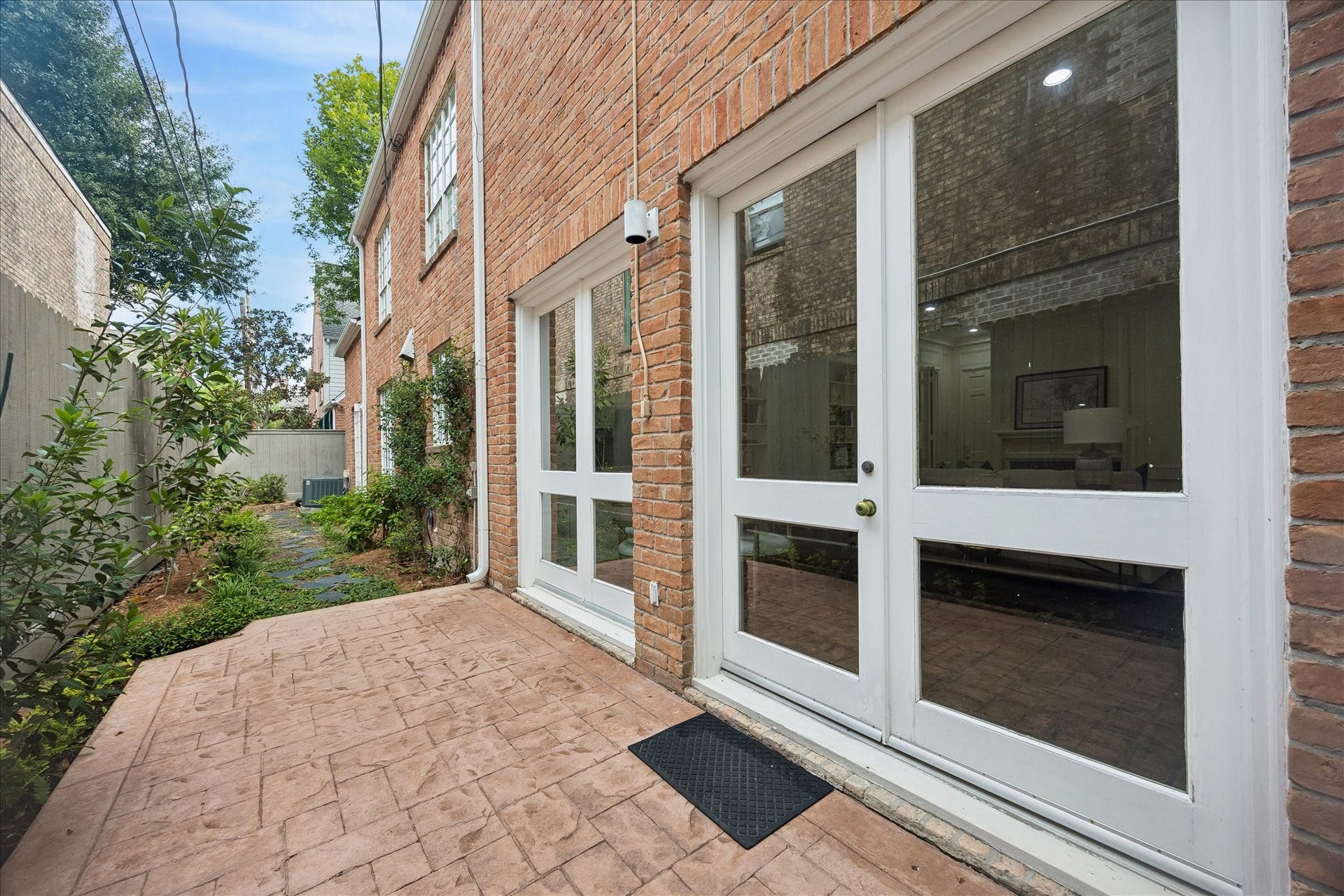 1422 Nantucket Drive, #C, Houston, TX 77057 Private rear patio with direct access from the family room, extending the living space outdoors.