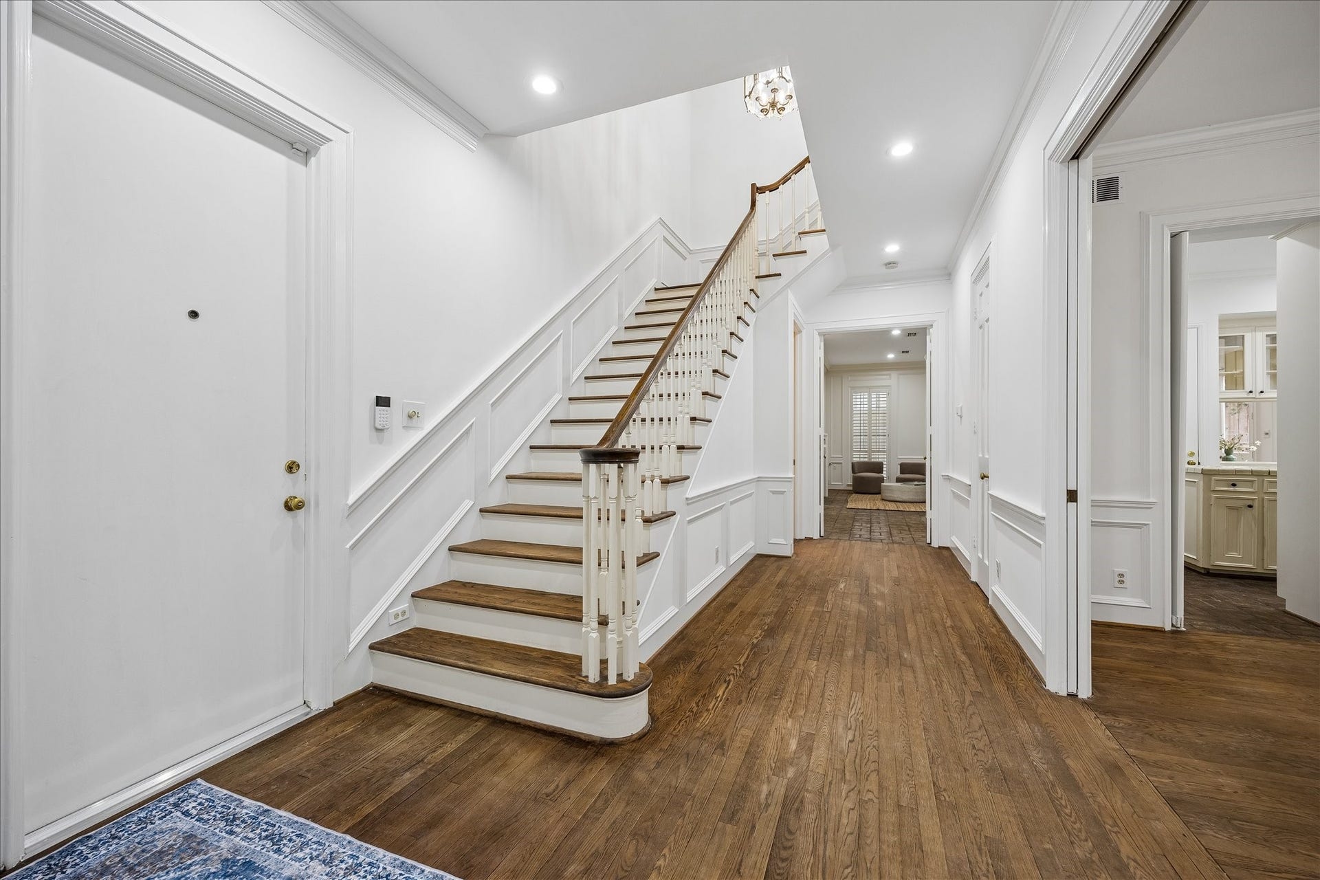 1422 Nantucket Drive, #C, Houston, TX 77057 Welcoming entry with hardwood floors, classic millwork and staircase leading to the second floor.