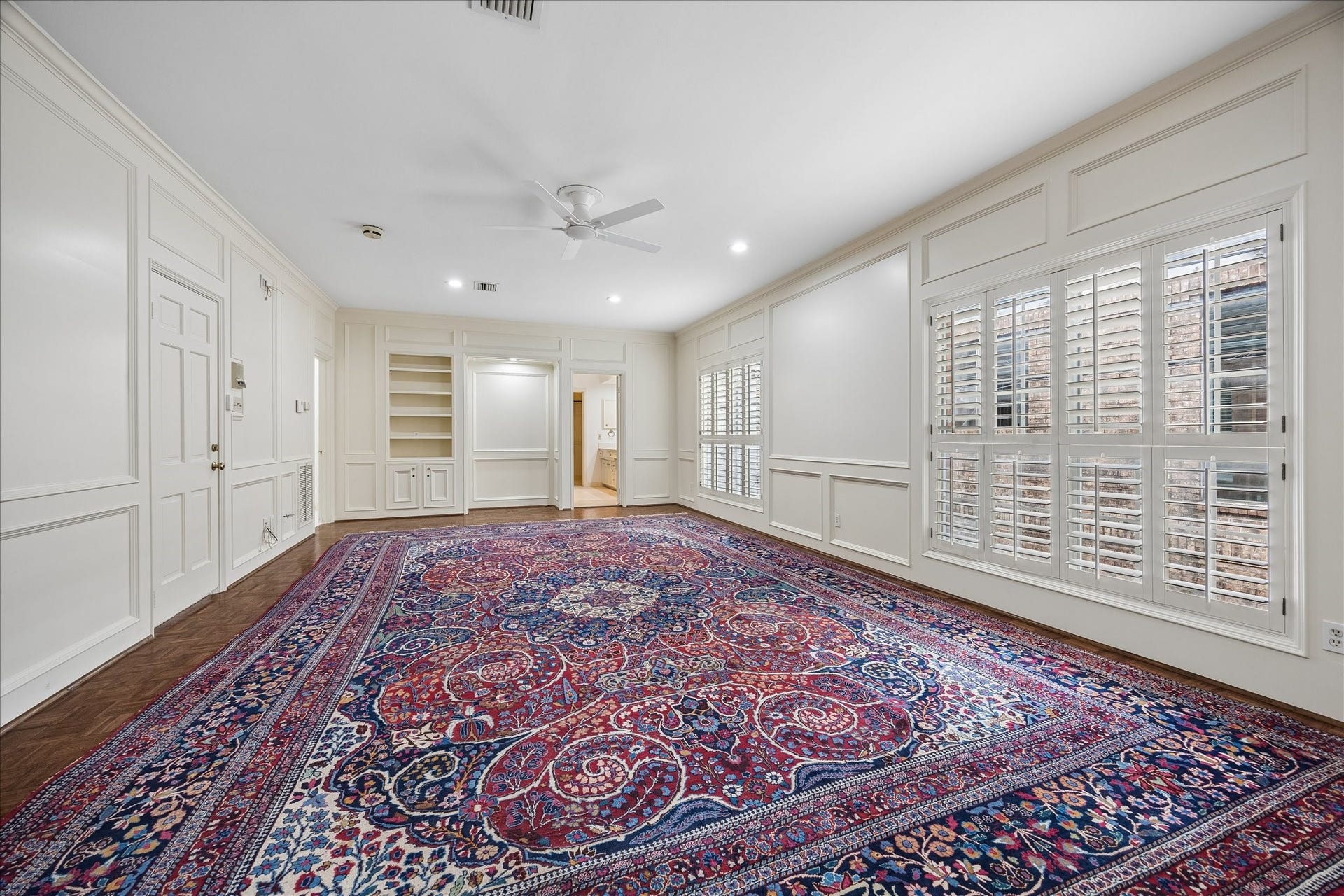 1422 Nantucket Drive, #C, Houston, TX 77057 Expansive primary suite with parquet hardwood floors, custom millwork and abundant natural light. Custom. Custom fit area rug will convey with property.