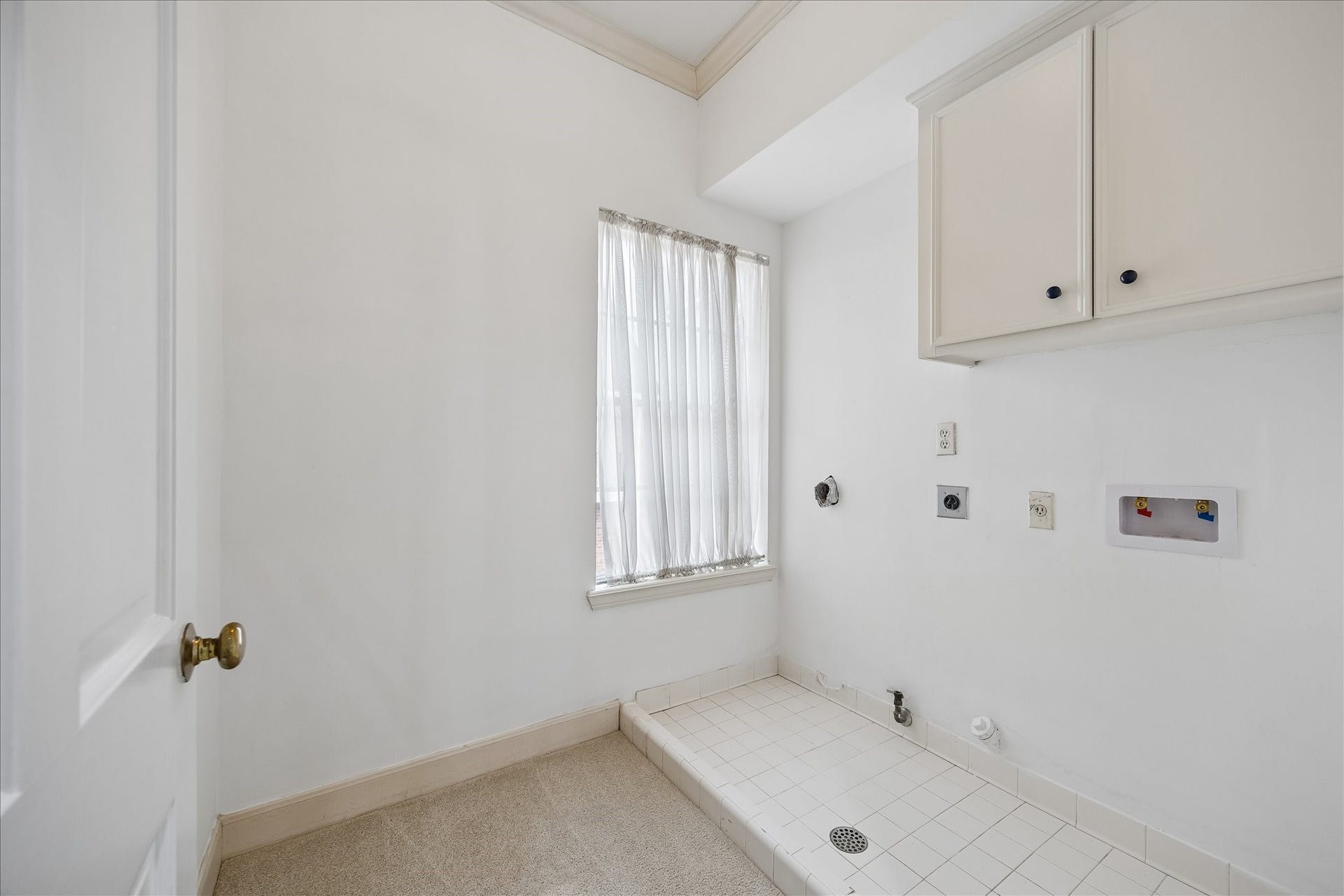 1422 Nantucket Drive, #C, Houston, TX 77057 Second-floor utility room with washer and dryer connections, built-in cabinetry and natural light.