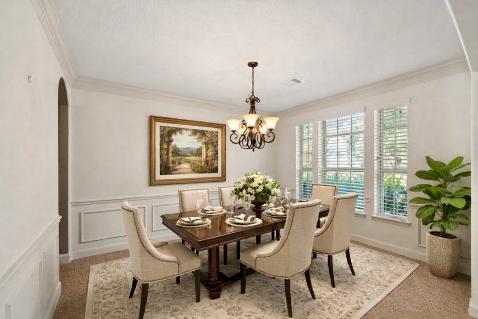 14318 Red Creek Cove Lane, Humble, TX 77396 This elegant dining room features a stylish chandelier, a large window with ample natural light, creating a warm and inviting atmosphere.