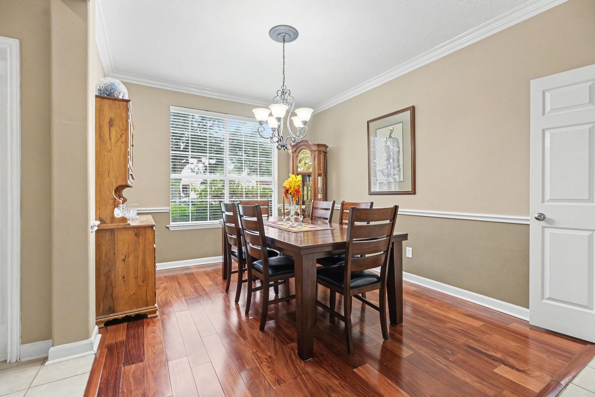2123 Autumn Cove Drive, League City, TX 77573 Dining room with beautiful cherry wood floors, crown molding and chair railing