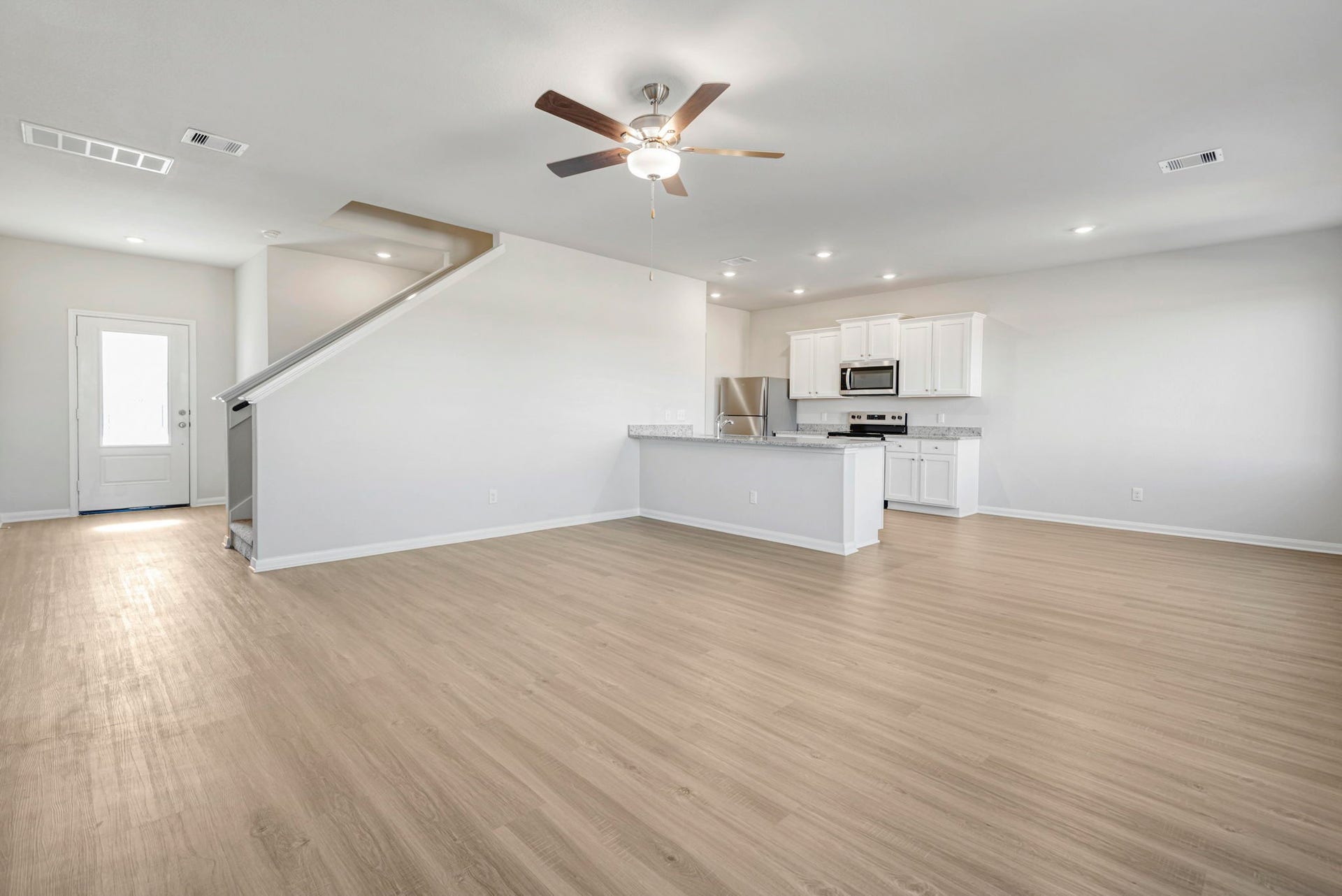 6418 Winter Elm Street, Houston, TX 77048 Spacious living room, open to the kitchen and dining area.
