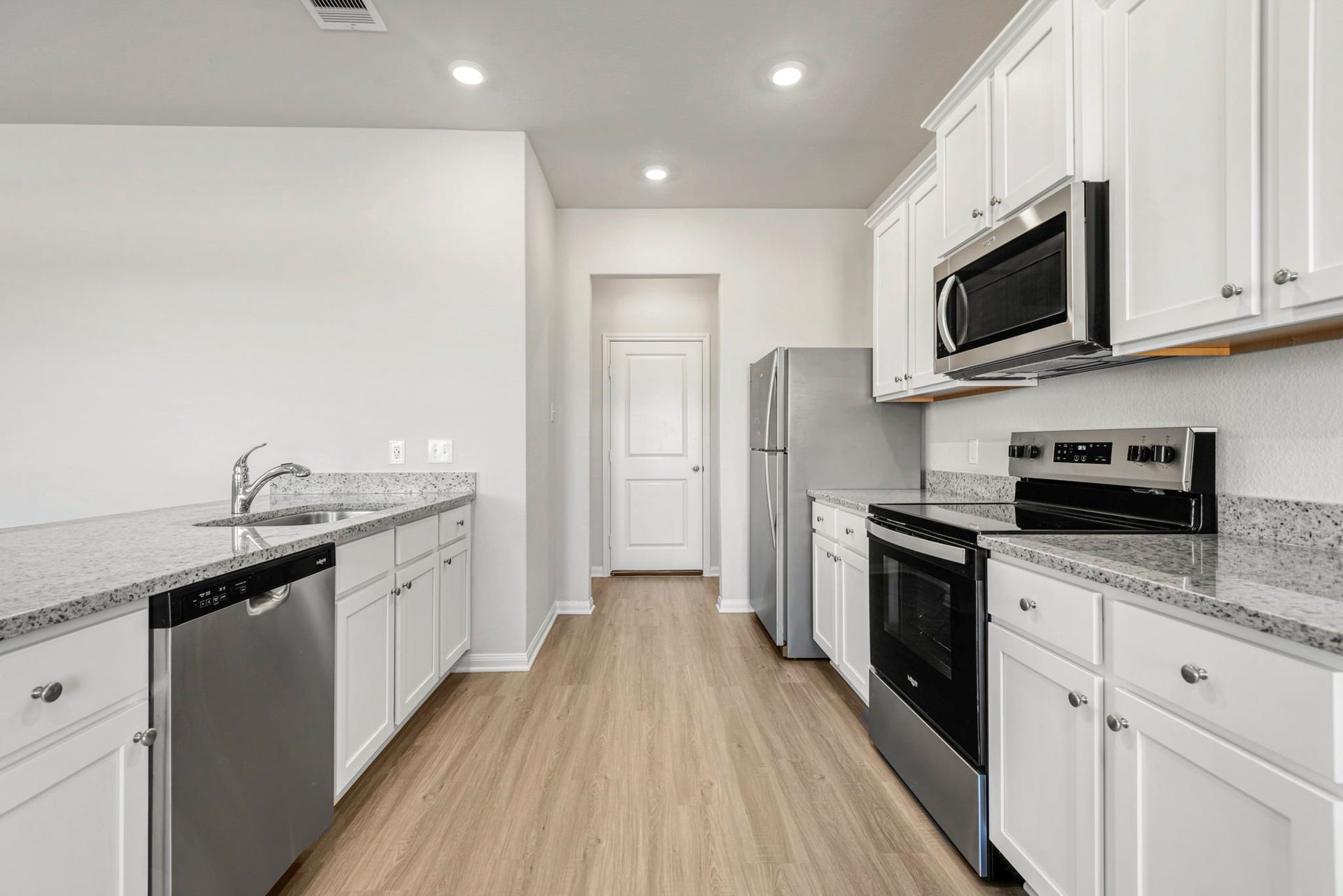 6418 Winter Elm Street, Houston, TX 77048 Kitchen with upgraded Whirlpool kitchen appliances.