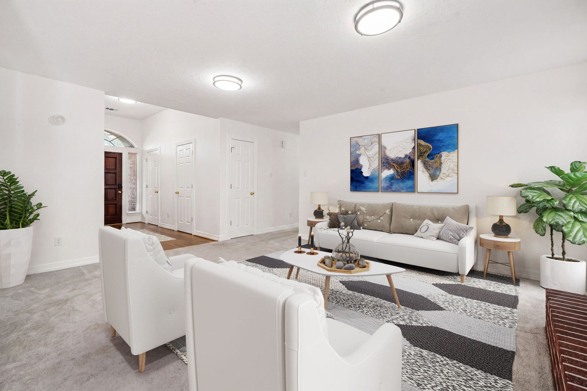 28310 Rose Lane, Katy, TX 77494 Inviting and versatile living space featuring crisp white walls, neutral carpeting, and modern overhead lighting that creates a bright, airy ambiance. The thoughtful layout offers clear visibility to the home's entry foyer, enhancing the open-concept feel and effortless flow of the floor plan. A perfect blank canvas with clean lines, ready for any design style.