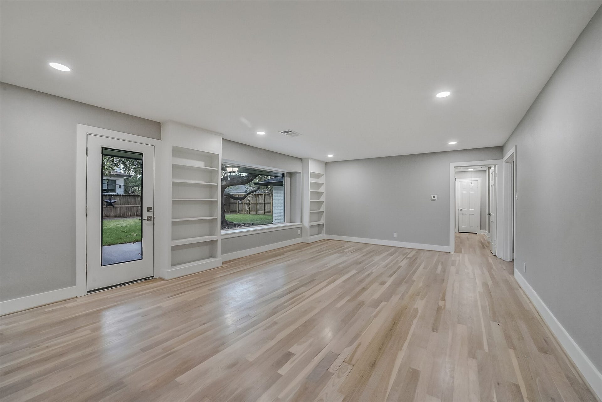 5318 Queensloch Drive, Houston, TX 77096 Book shelves and open lighting are also featured in the kitchen and living/dining space. Wonderful for entertaining family and guest!