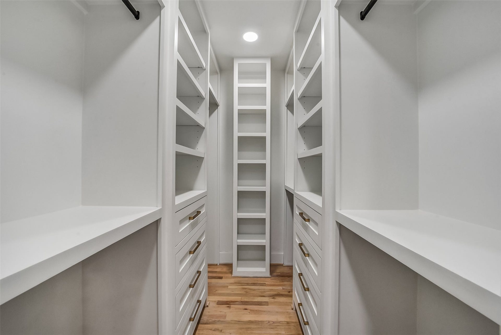5318 Queensloch Drive, Houston, TX 77096 Master Closet with customer built-in drawers and ample hanging space and shoe display.