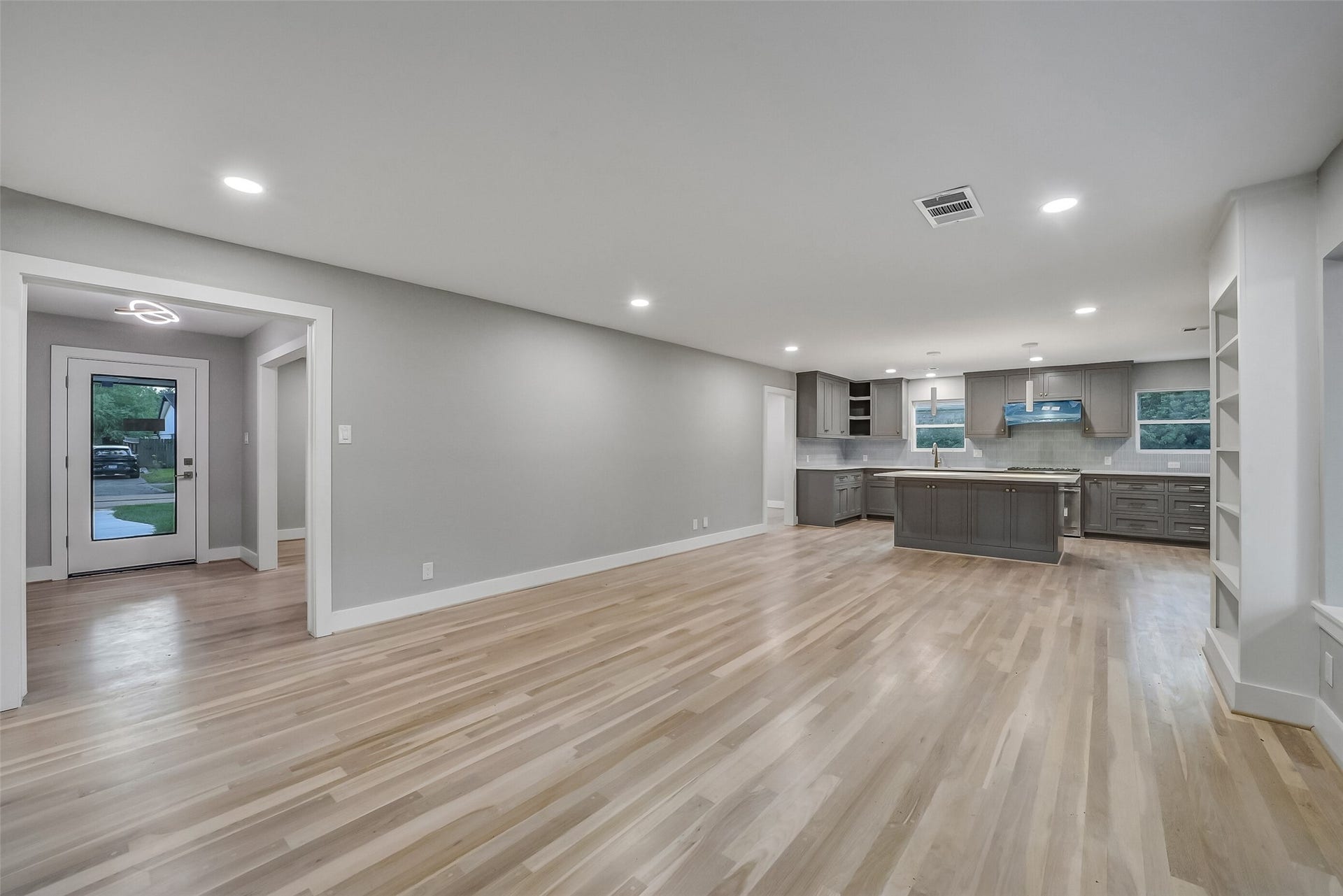 5318 Queensloch Drive, Houston, TX 77096 Another angle of the kitchen with open living/dining space.