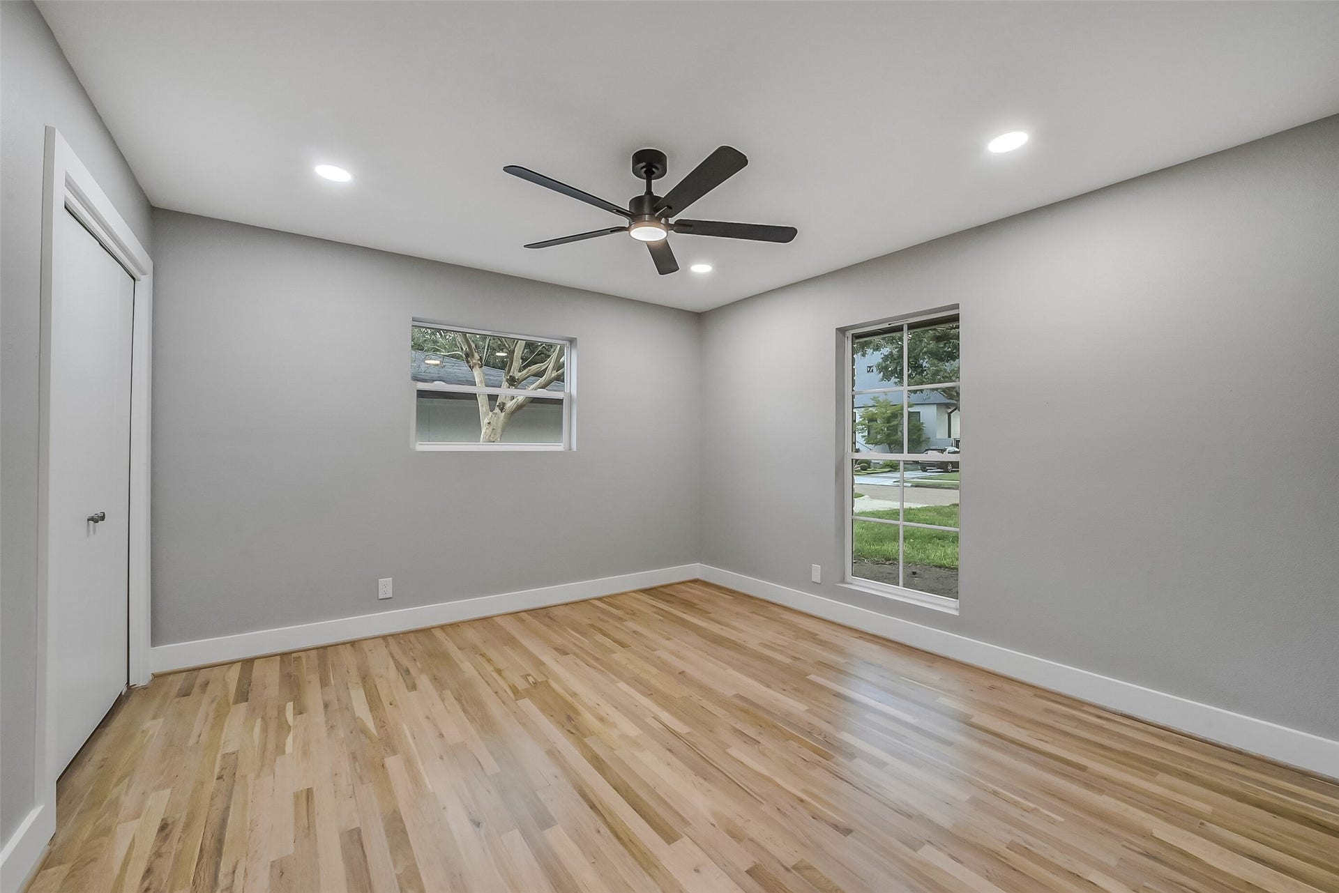 5318 Queensloch Drive, Houston, TX 77096 Secondary Bedroom with updated fan with light. Multiple windows lets all the natural light in.
