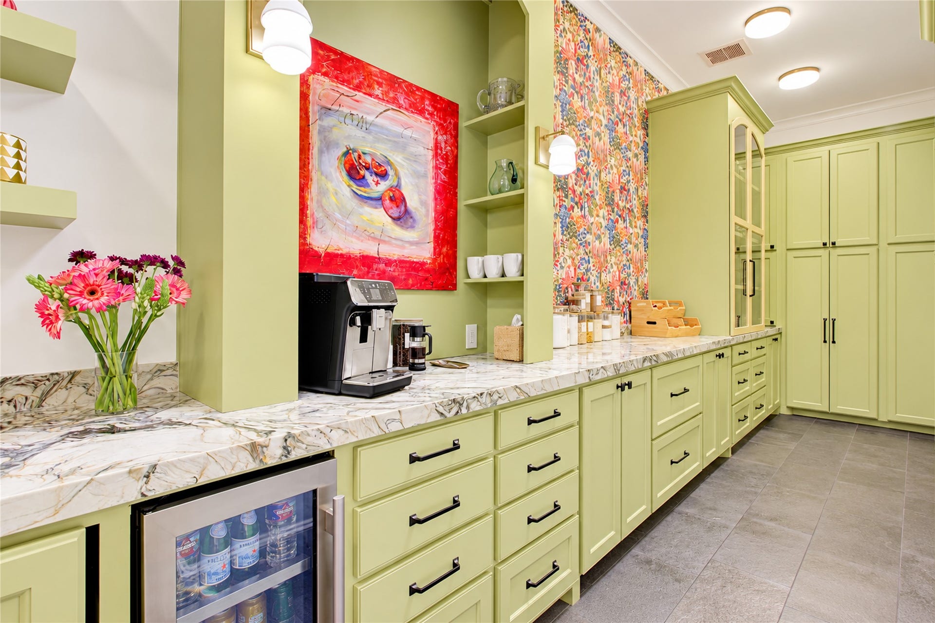 2215 North Boulevard, Houston, TX 77098 Soft sage-green cabinetry and distinctive Green Fusion quartzite countertops bring refined character to this dedicated prep kitchen.