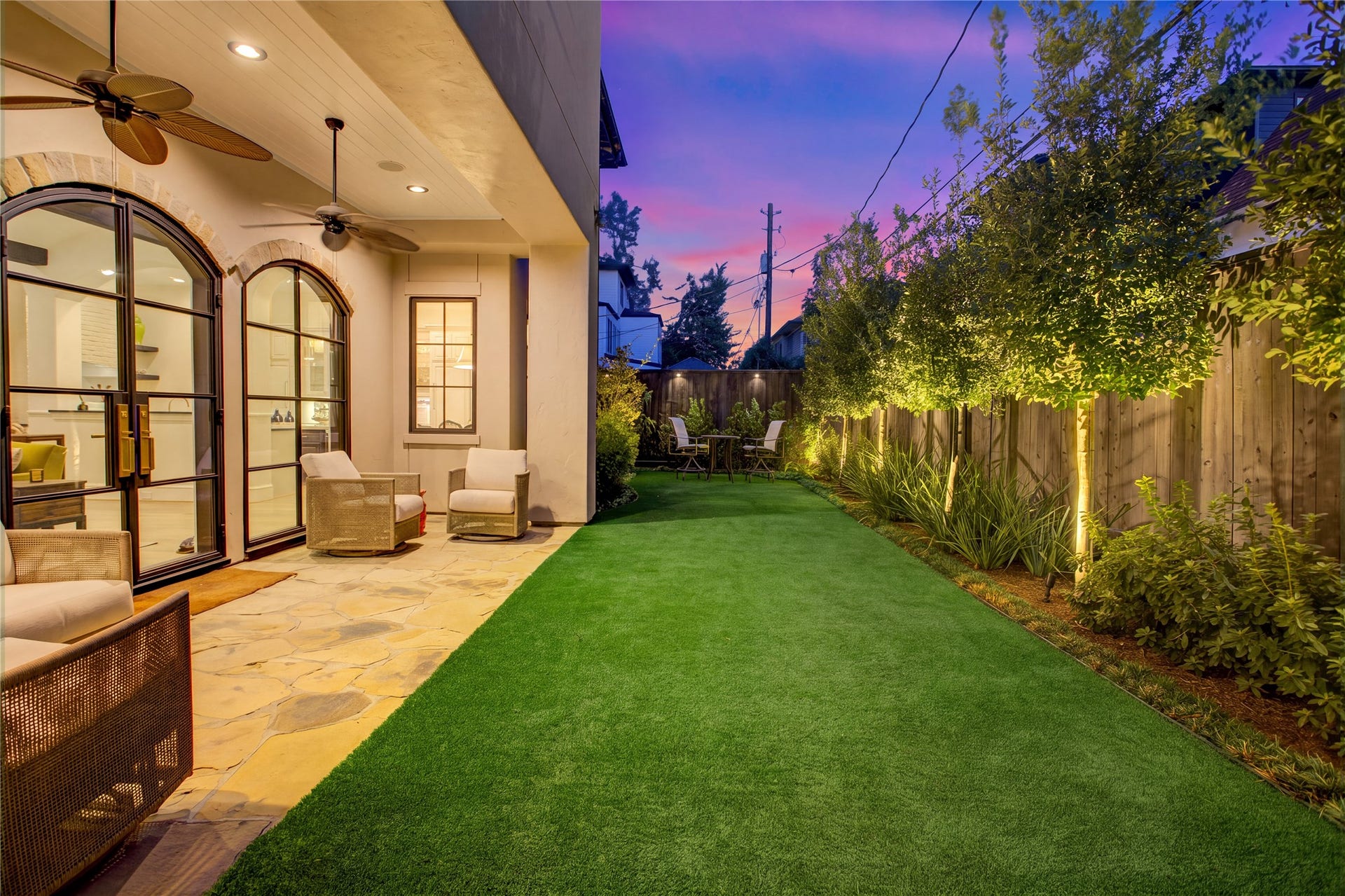 2215 North Boulevard, Houston, TX 77098 Eight newly planted trees, LED landscape lighting, and full fencing enhance the privacy and appeal of this outdoor retreat.