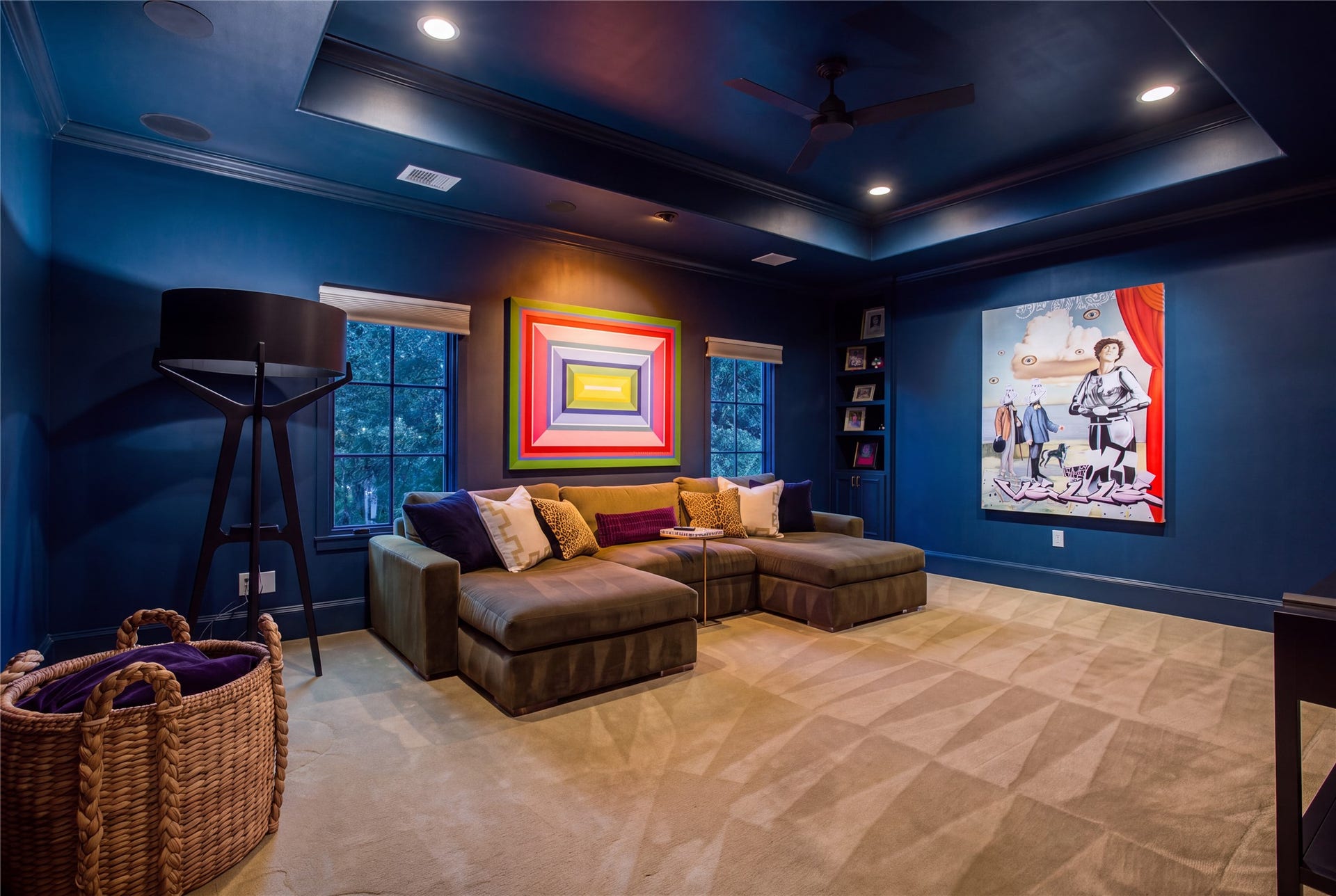 2215 North Boulevard, Houston, TX 77098 A spacious media retreat featuring a 10-foot tray ceiling, in-ceiling audio, and room for oversized sectional seating.