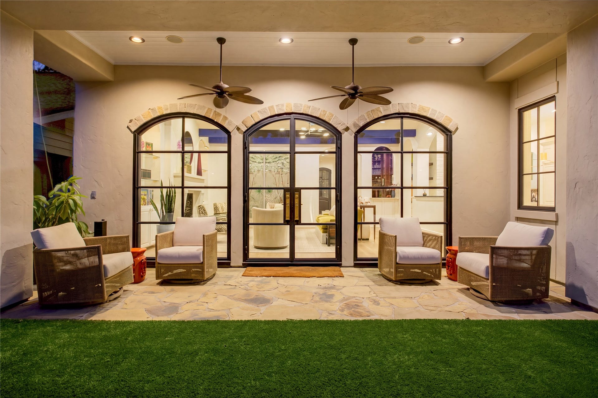 2215 North Boulevard, Houston, TX 77098 Refined outdoor living with natural flagstone, a classic beadboard ceiling, dual ceiling fans, and lush premium turf.