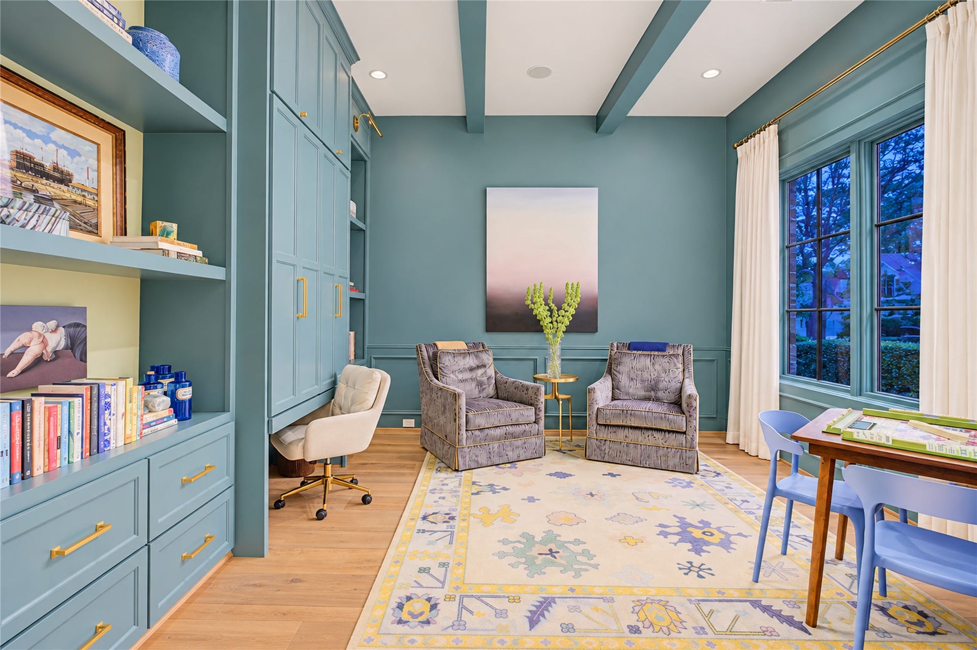 2215 North Boulevard, Houston, TX 77098 Floor-to-ceiling soft-close built-ins conceal a bi-fold desk system, blending refined millwork with discreet functionality.