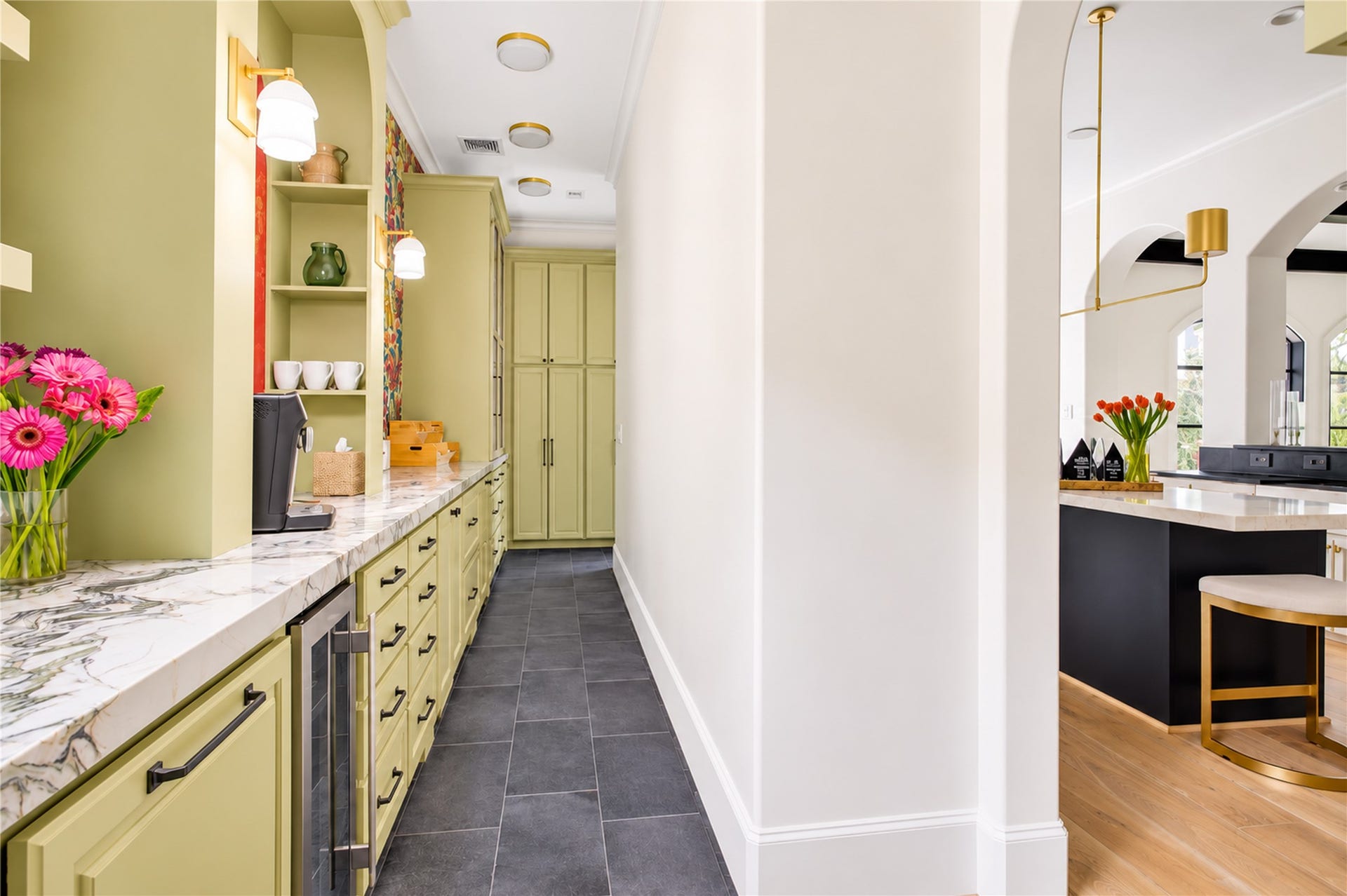 2215 North Boulevard, Houston, TX 77098 Floor-to-ceiling cabinetry maximizes storage while lending a seamless, tailored aesthetic to this dedicated prep kitchen.