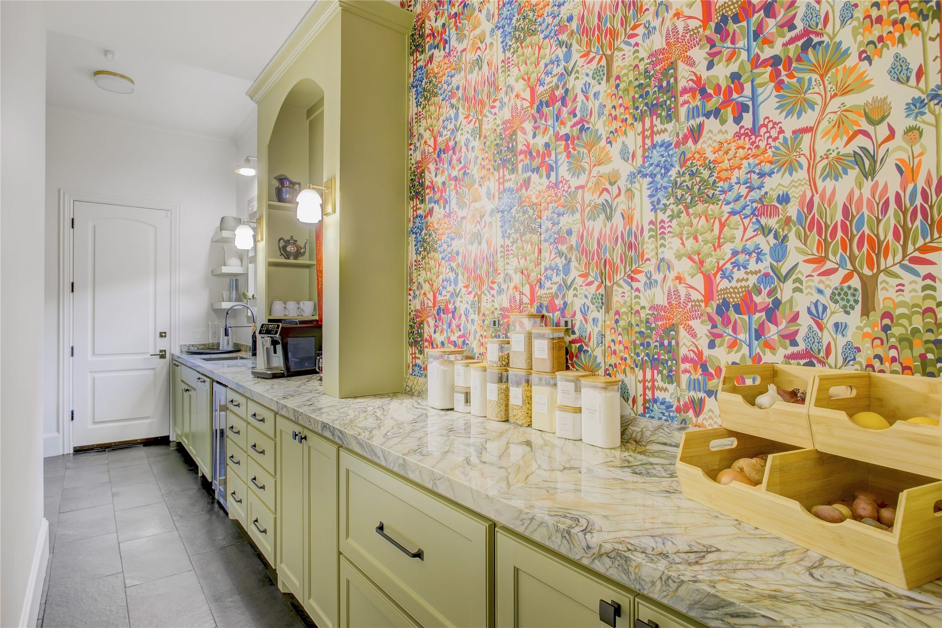 2215 North Boulevard, Houston, TX 77098 Playful Thibaut wallpaper adds designer flair to this prep kitchen, complete with a dedicated coffee station.