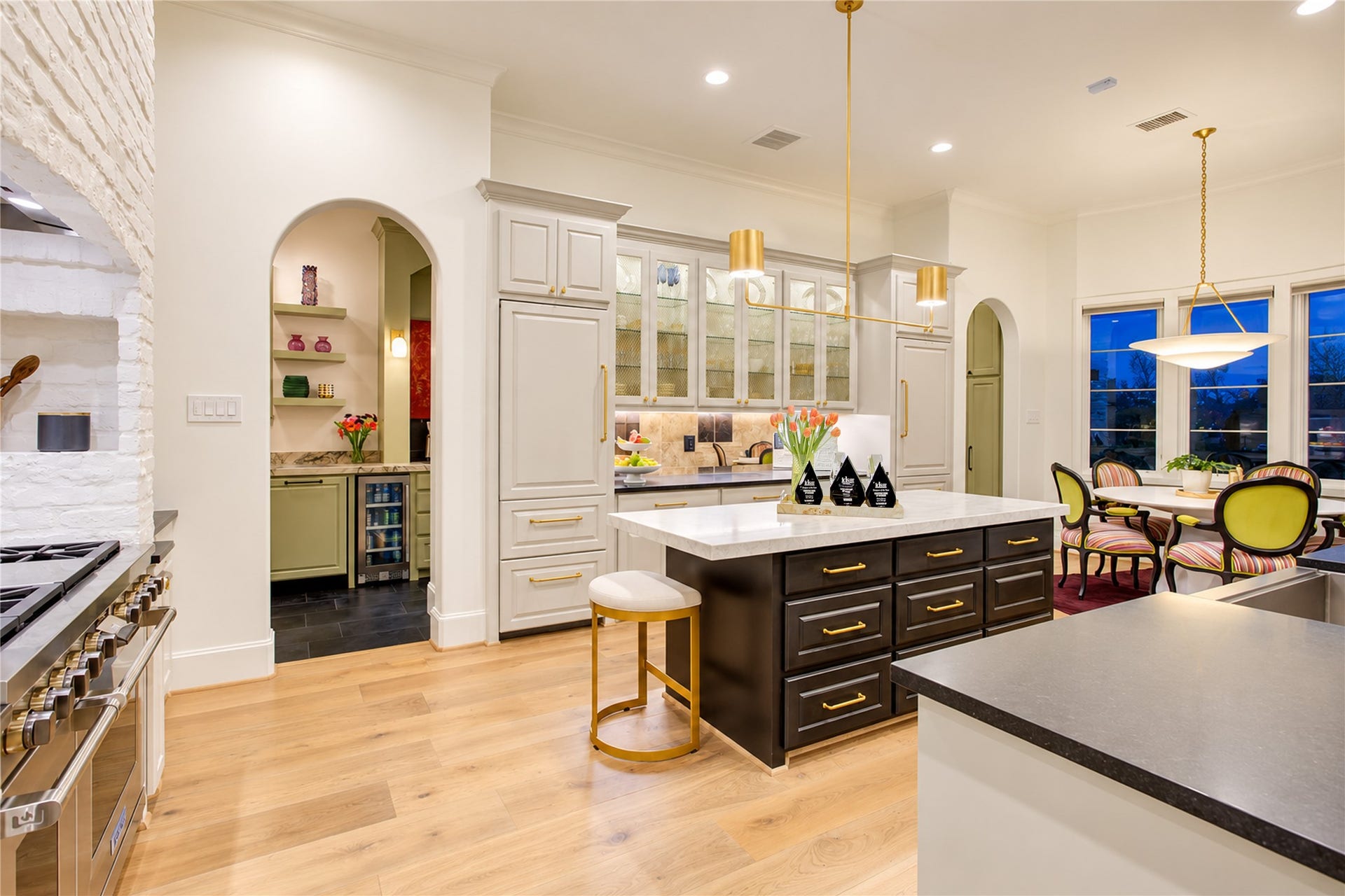 2215 North Boulevard, Houston, TX 77098 A tailored serving station bridges the all-refrigerator and all-freezer columns, adding thoughtful utility to this chef-inspired kitchen.