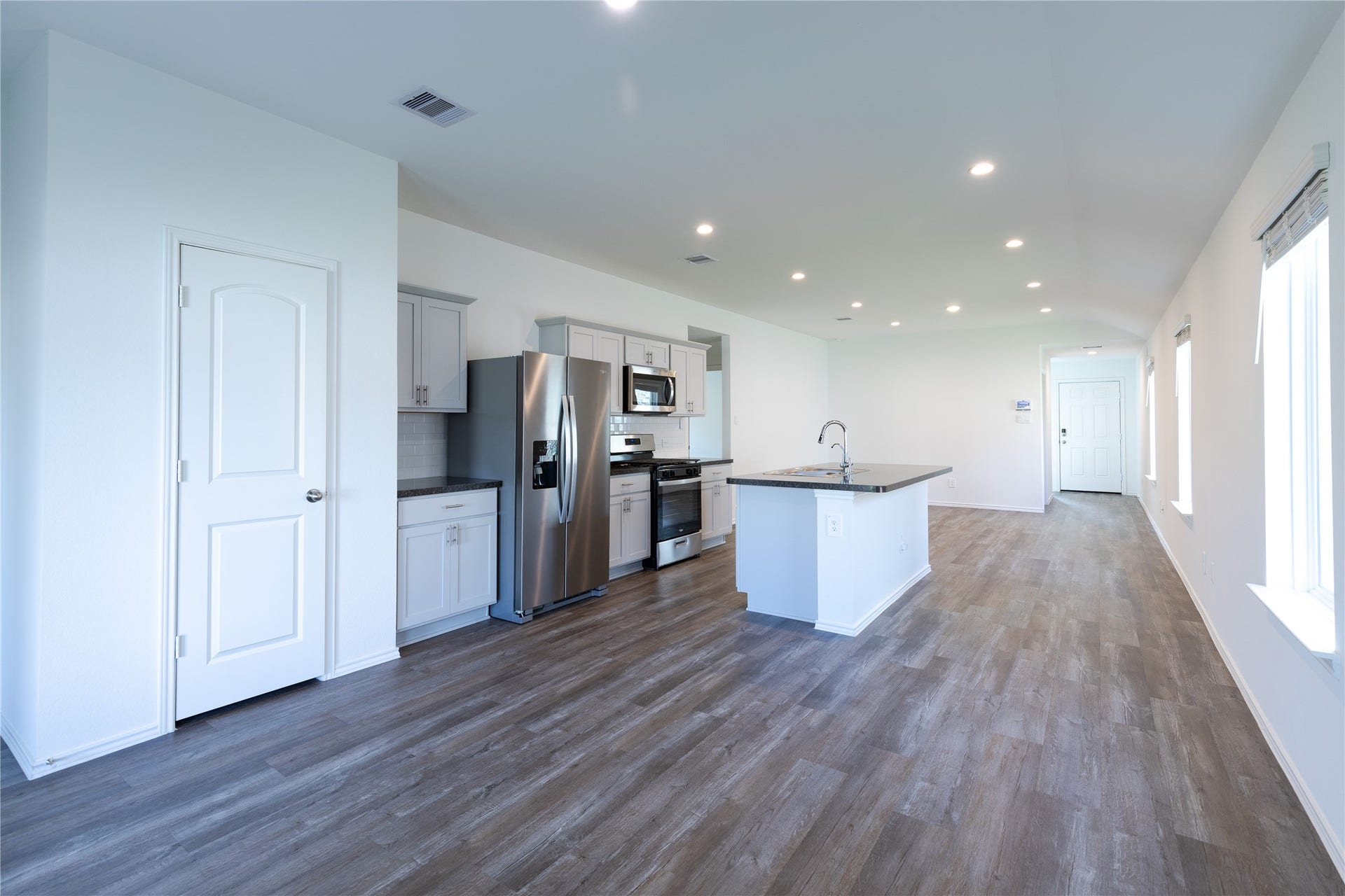 24330 Saddlestone Green Drive, Spring, TX 77373 The open family room is warmly integrated with the kitchen for easy entertaining
