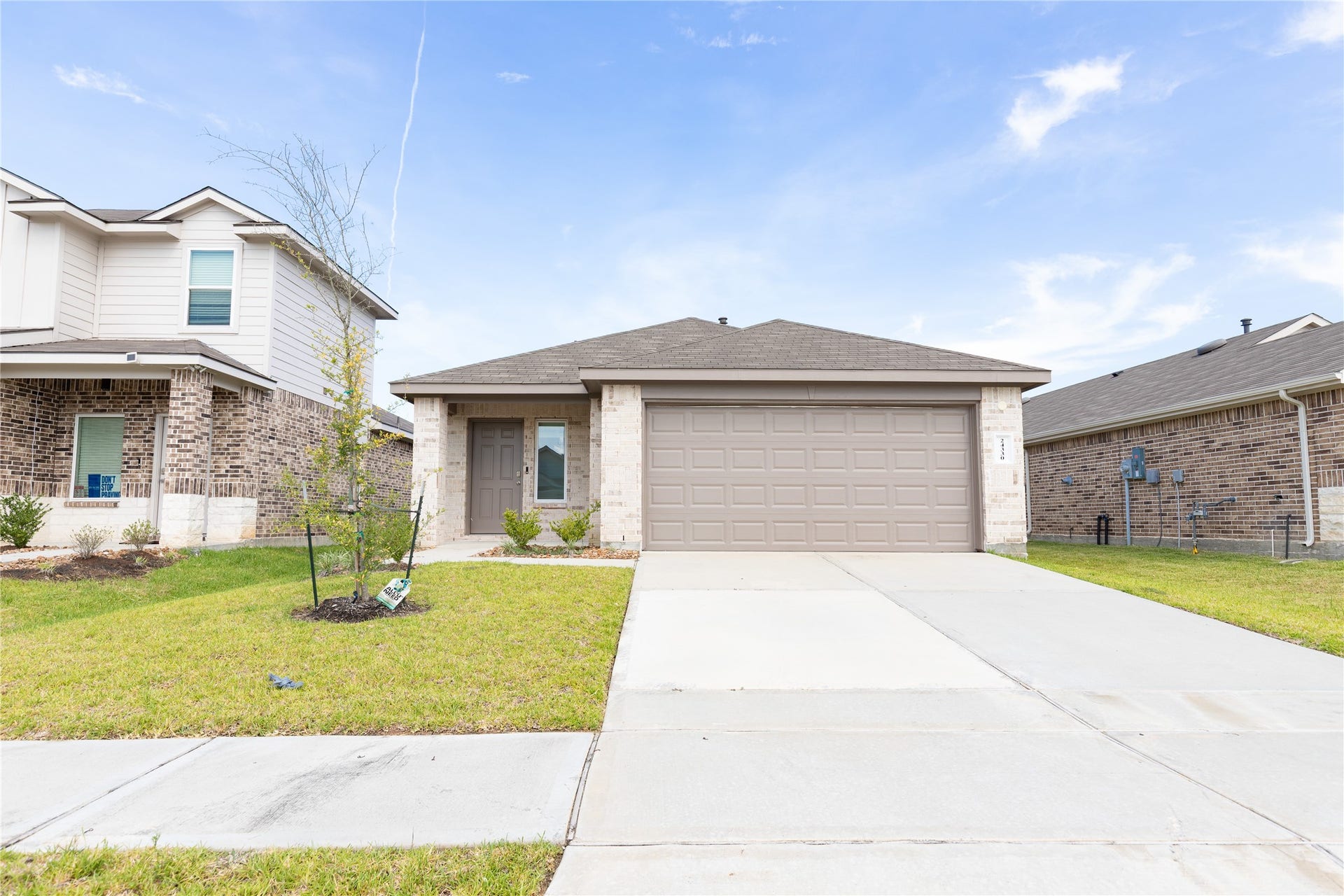 24330 Saddlestone Green Drive, Spring, TX 77373 Beautiful front elevation with great curb appeal and a welcoming entrance