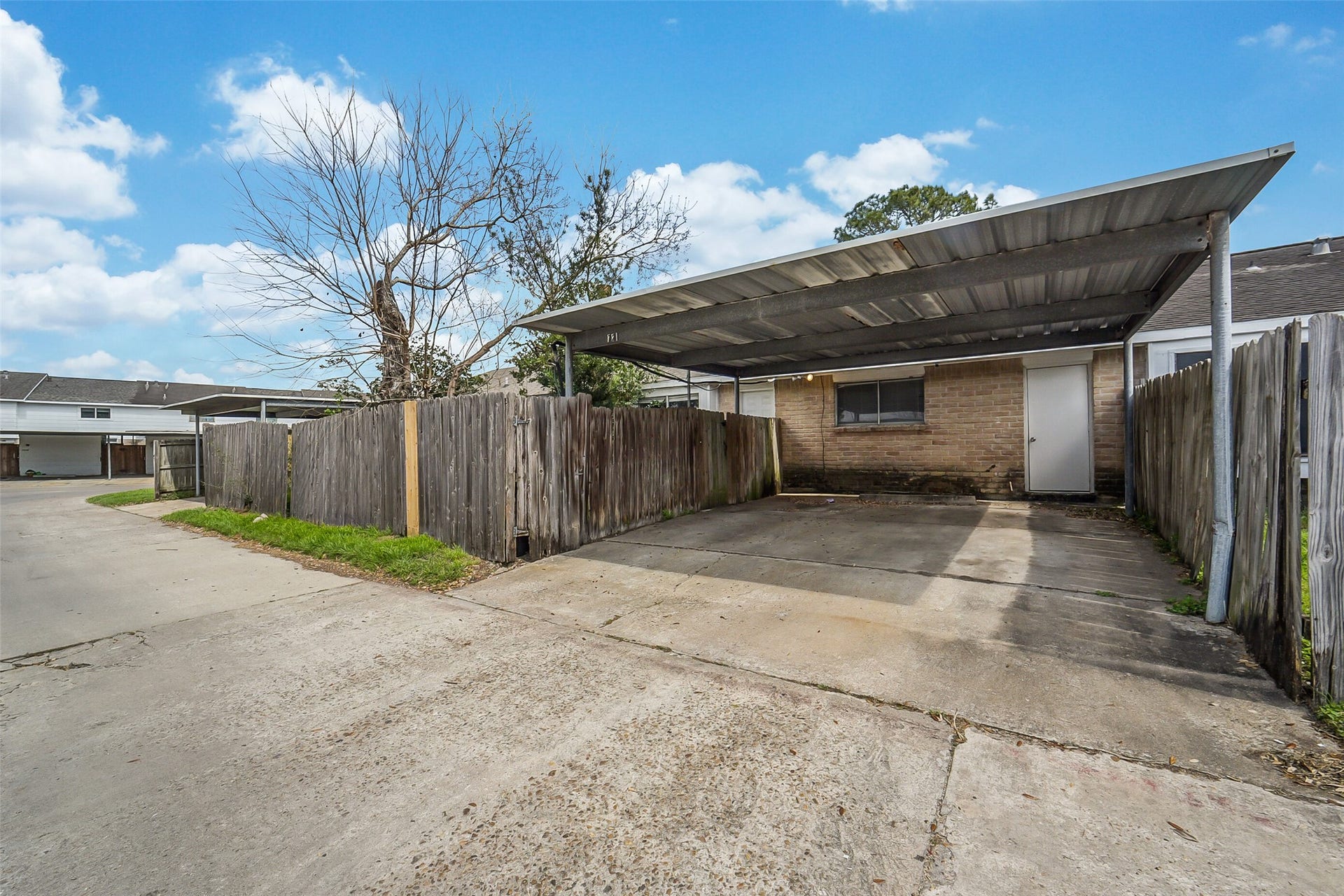 7265 Chasewood Drive, Houston, TX 77489 Enjoy the convenience of a covered two-car carport with direct gated access to the private backyard. Located just steps from the home's rear entrance, this protected parking area makes unloading groceries and everyday living both easy and convenient.