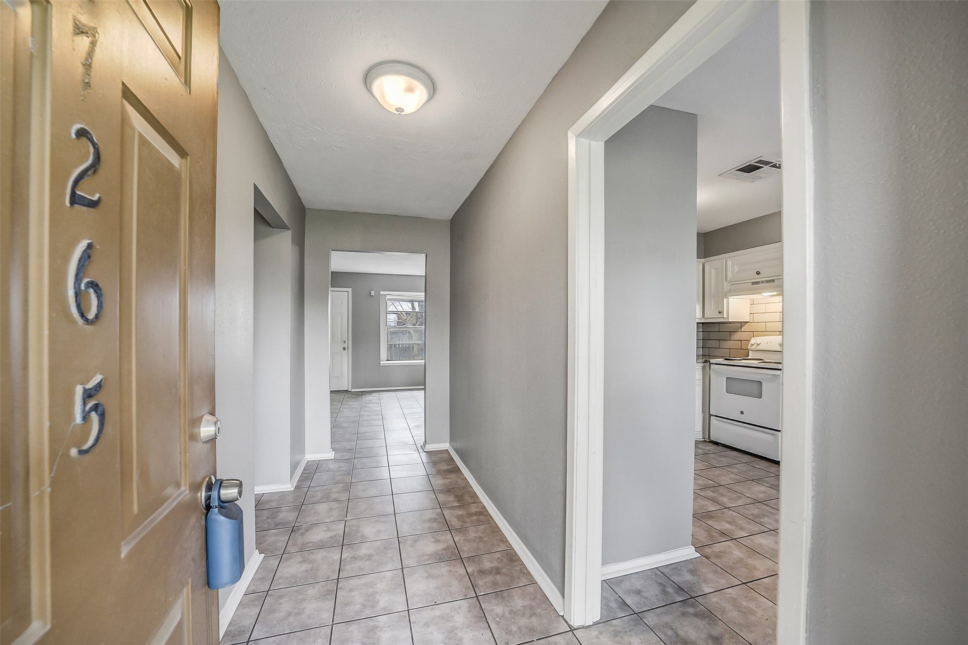 7265 Chasewood Drive, Houston, TX 77489 Step inside to a freshly updated interior where neutral paint and durable tile flooring create a bright, move-in-ready first impression. The welcoming entry hall provides easy access to the kitchen while drawing your eye toward the spacious living area beyond.