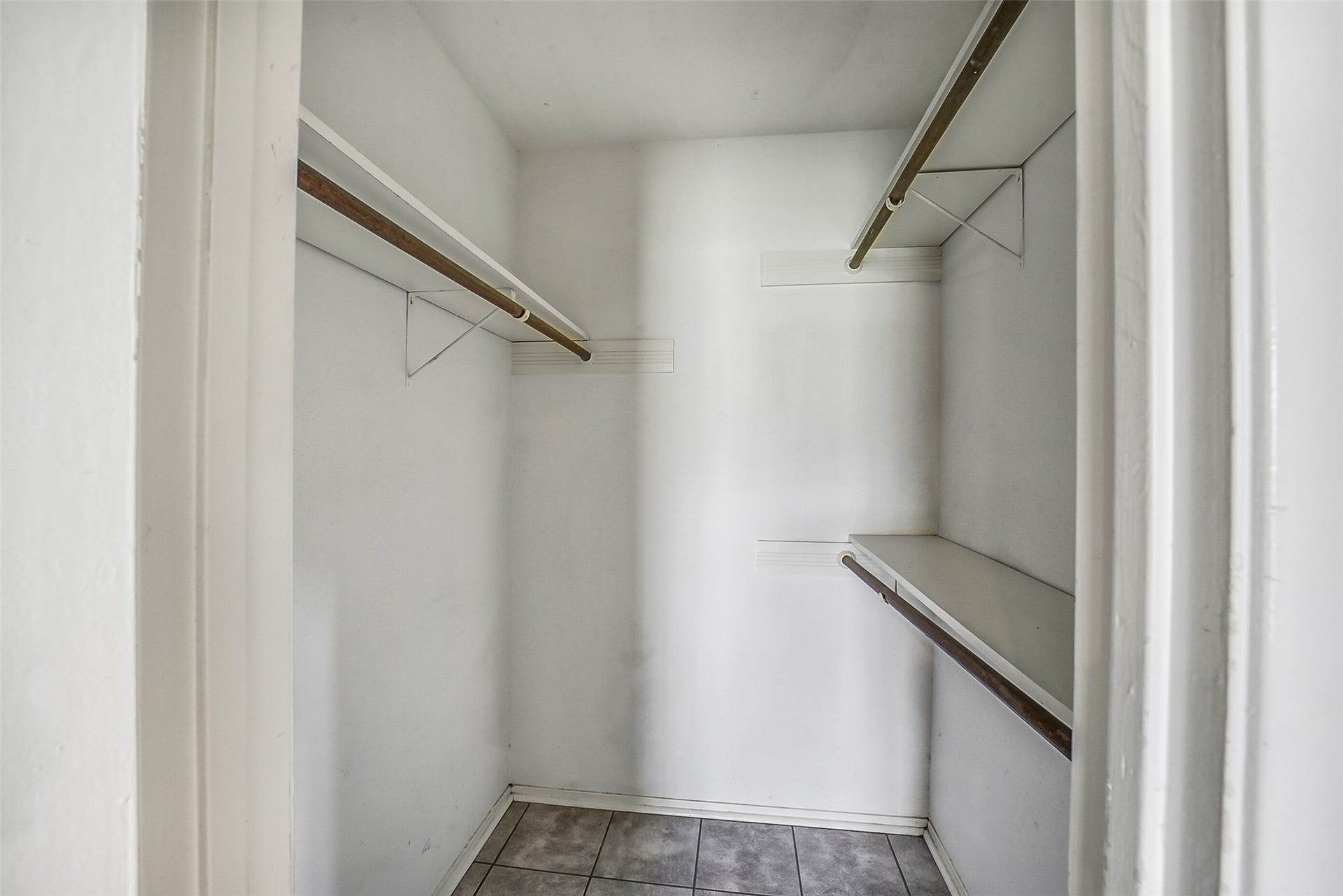 7265 Chasewood Drive, Houston, TX 77489 Storage is abundant with dual walk-in closets offering generous hanging space and built-in shelving. Whether organizing seasonal wardrobes or everyday essentials, this thoughtfully designed storage area helps keep everything neatly within reach.