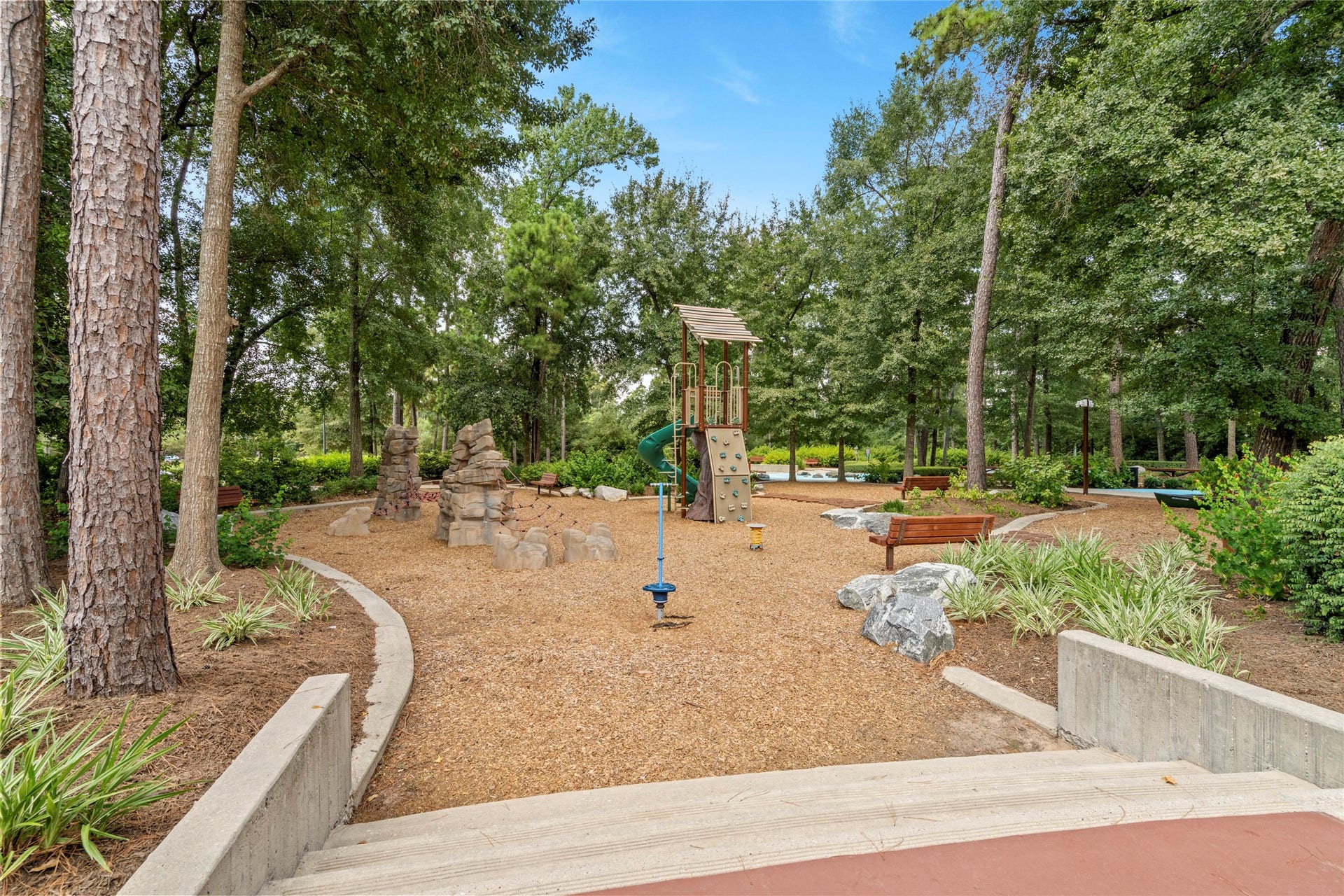 16955 Chapel Knox Drive, Humble, TX 77346 Wooded children's playground and nature-inspired play area available to residents of The Groves.