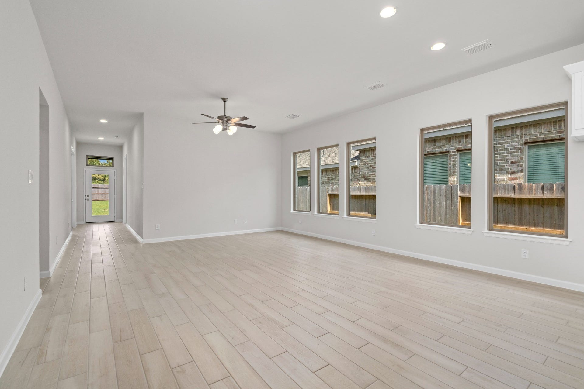 16955 Chapel Knox Drive, Humble, TX 77346 Spacious living area with large backyard-facing windows that bring in natural light.