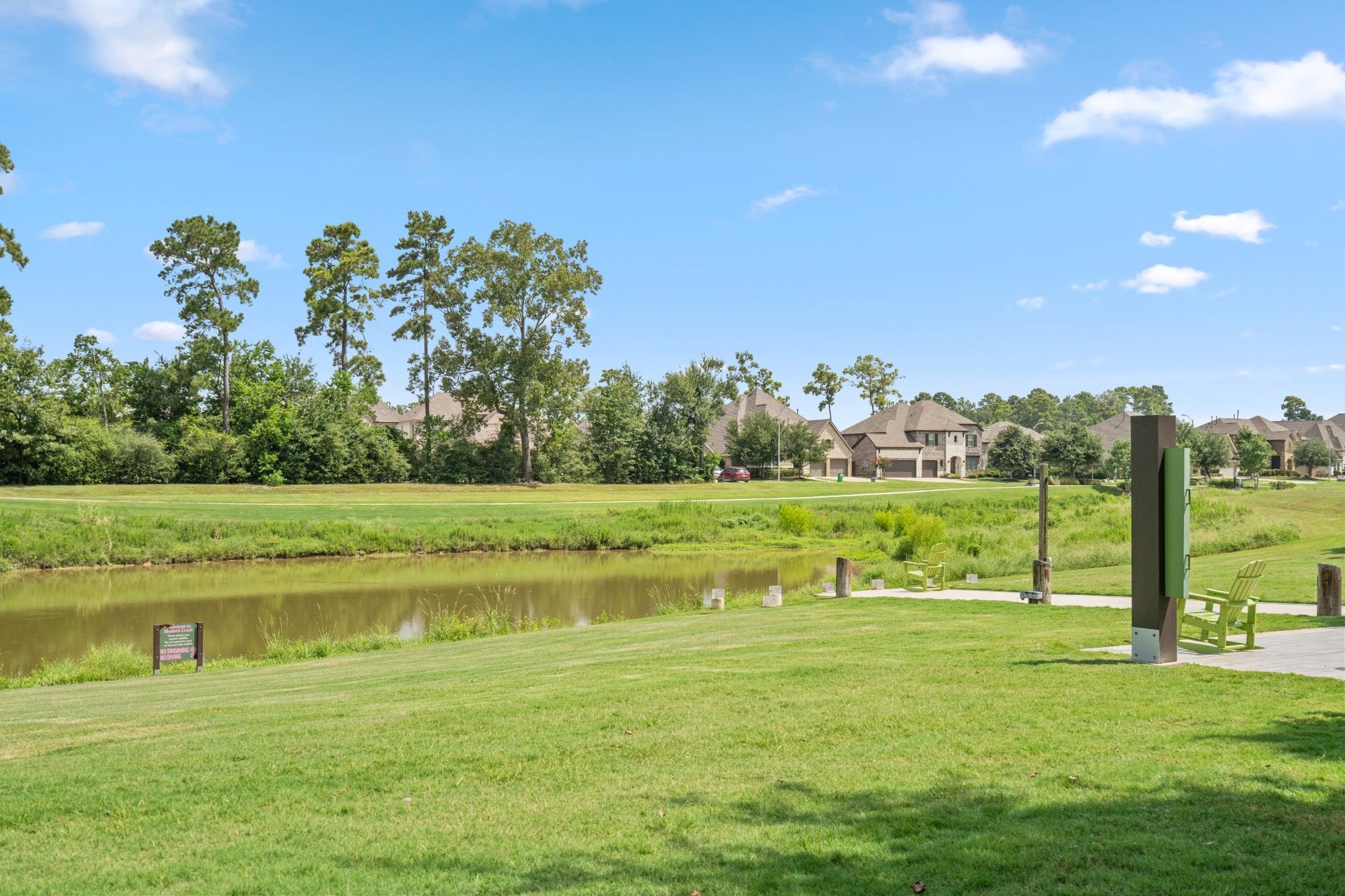 16955 Chapel Knox Drive, Humble, TX 77346 Community pond, walking area and green space showcasing the outdoor lifestyle available in The Groves.