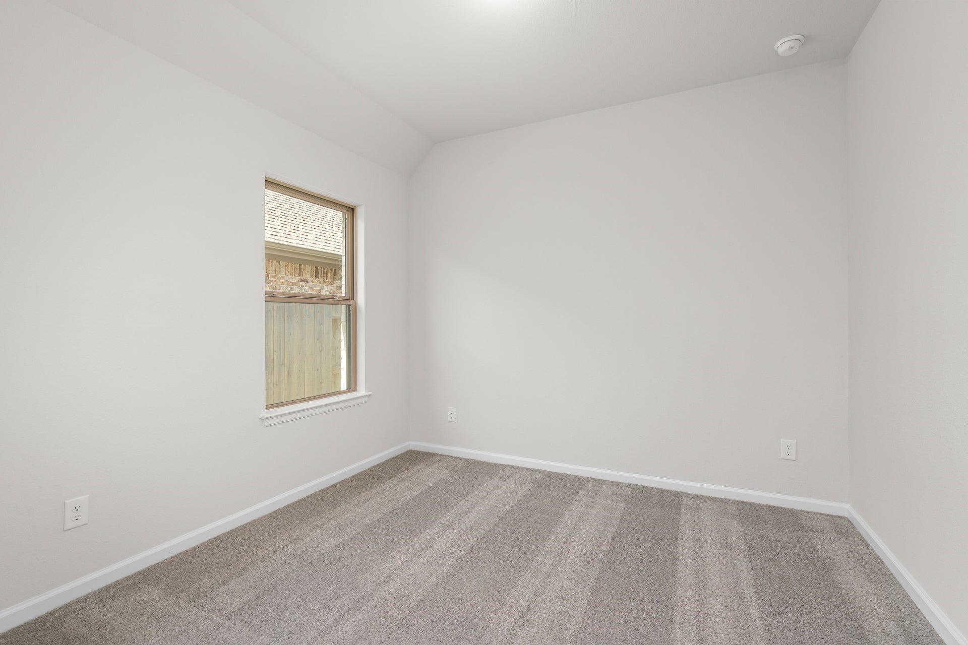 16955 Chapel Knox Drive, Humble, TX 77346 Additional secondary bedroom with neutral finishes and window, offering flexible space for guests or family.