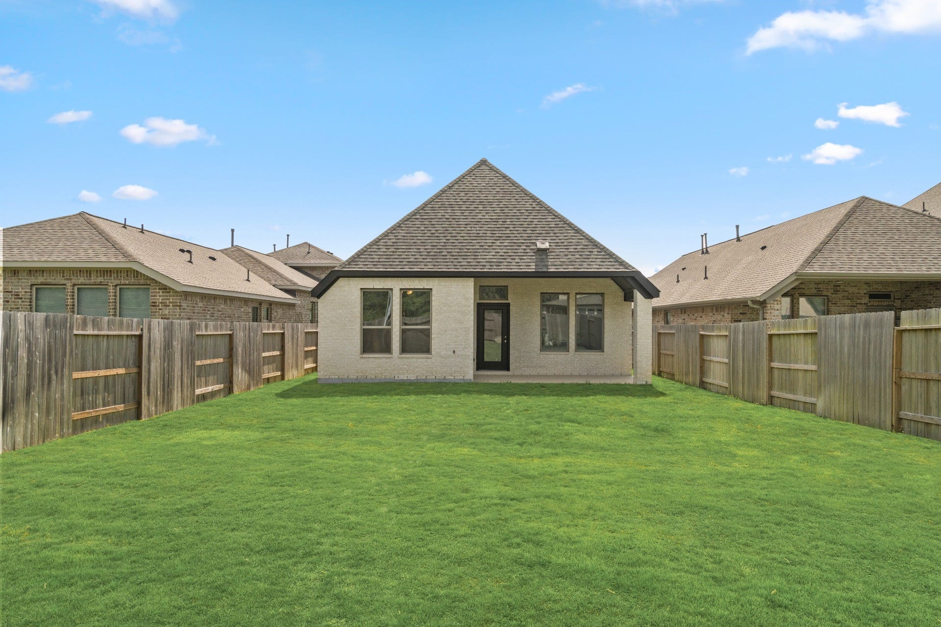 16955 Chapel Knox Drive, Humble, TX 77346 Large fenced backyard and rear exterior with room for outdoor living, play and entertaining.