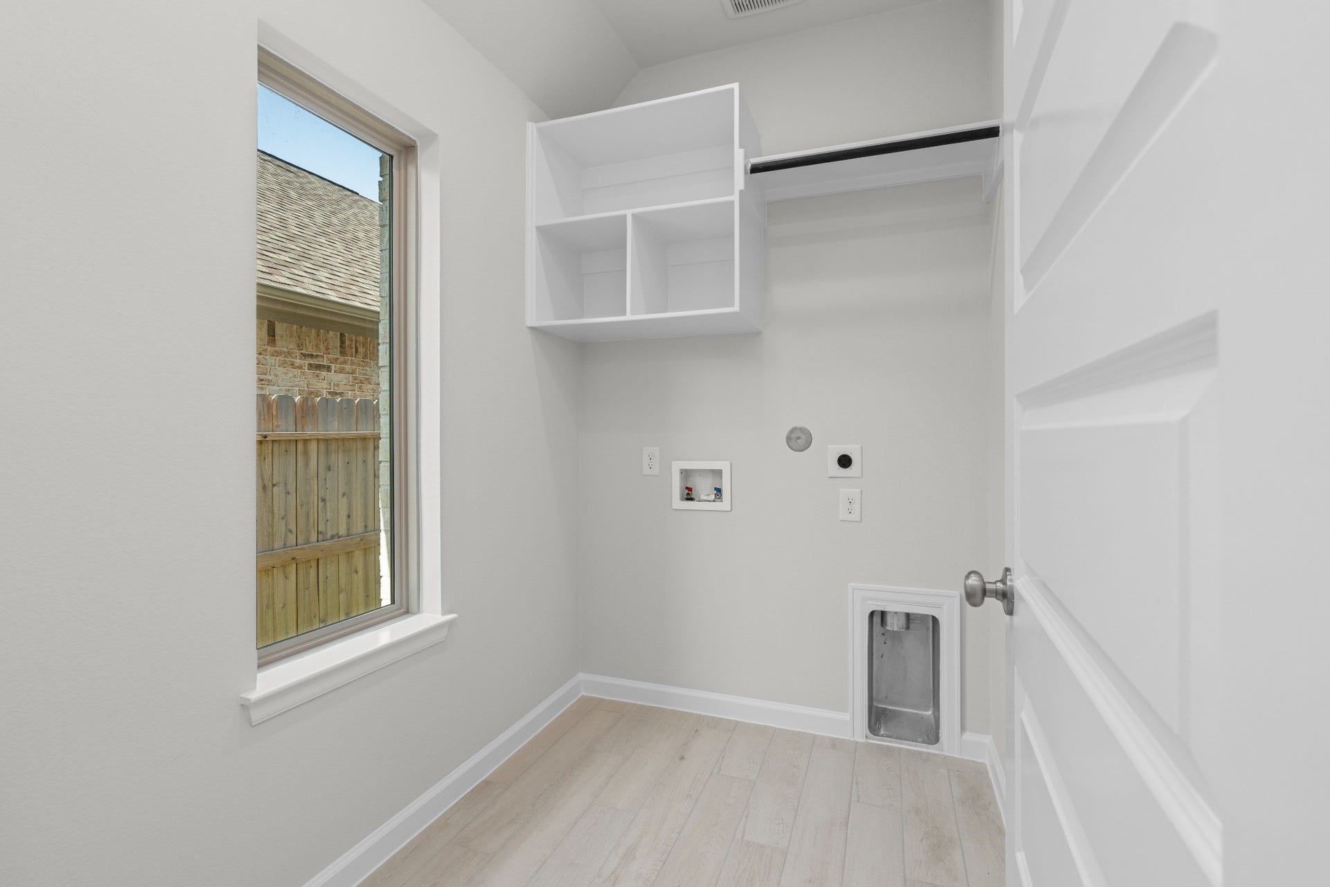 16955 Chapel Knox Drive, Humble, TX 77346 Dedicated interior laundry room with storage cabinetry and space for a full-size washer and dryer.