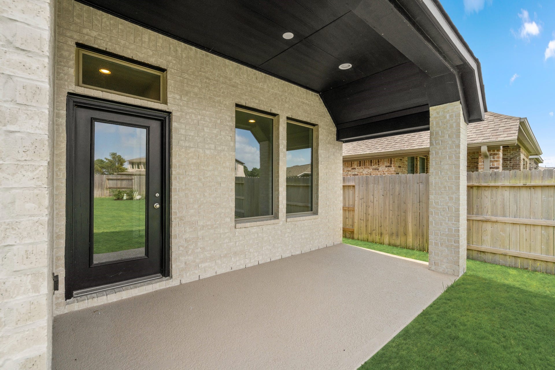 16955 Chapel Knox Drive, Humble, TX 77346 Covered rear patio with recessed lighting provides shaded outdoor living space.
