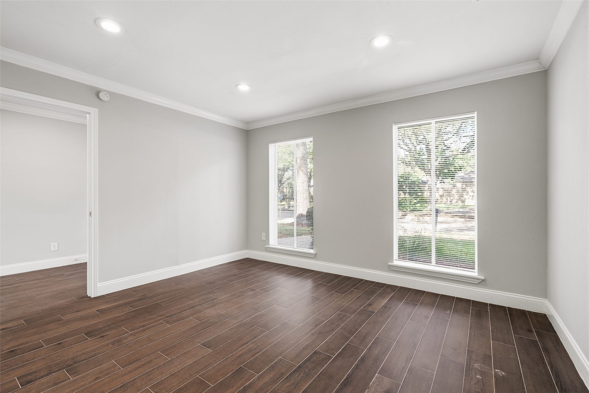 Bright and inviting room with large windows offering ample natural light.