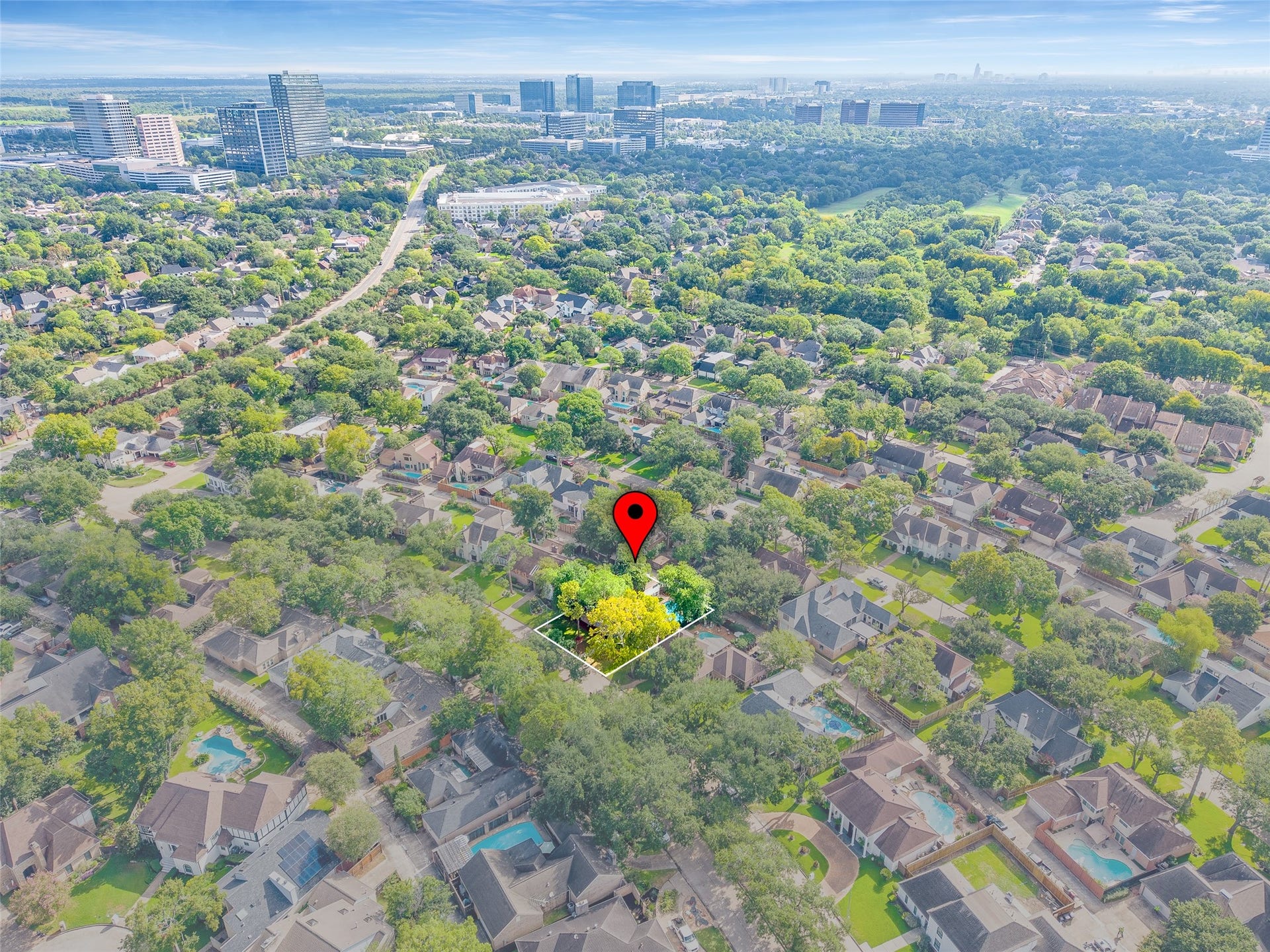 Nestled in a lush, tree-lined neighborhood, this home offers a serene suburban retreat with convenient proximity to urban amenities and city views.