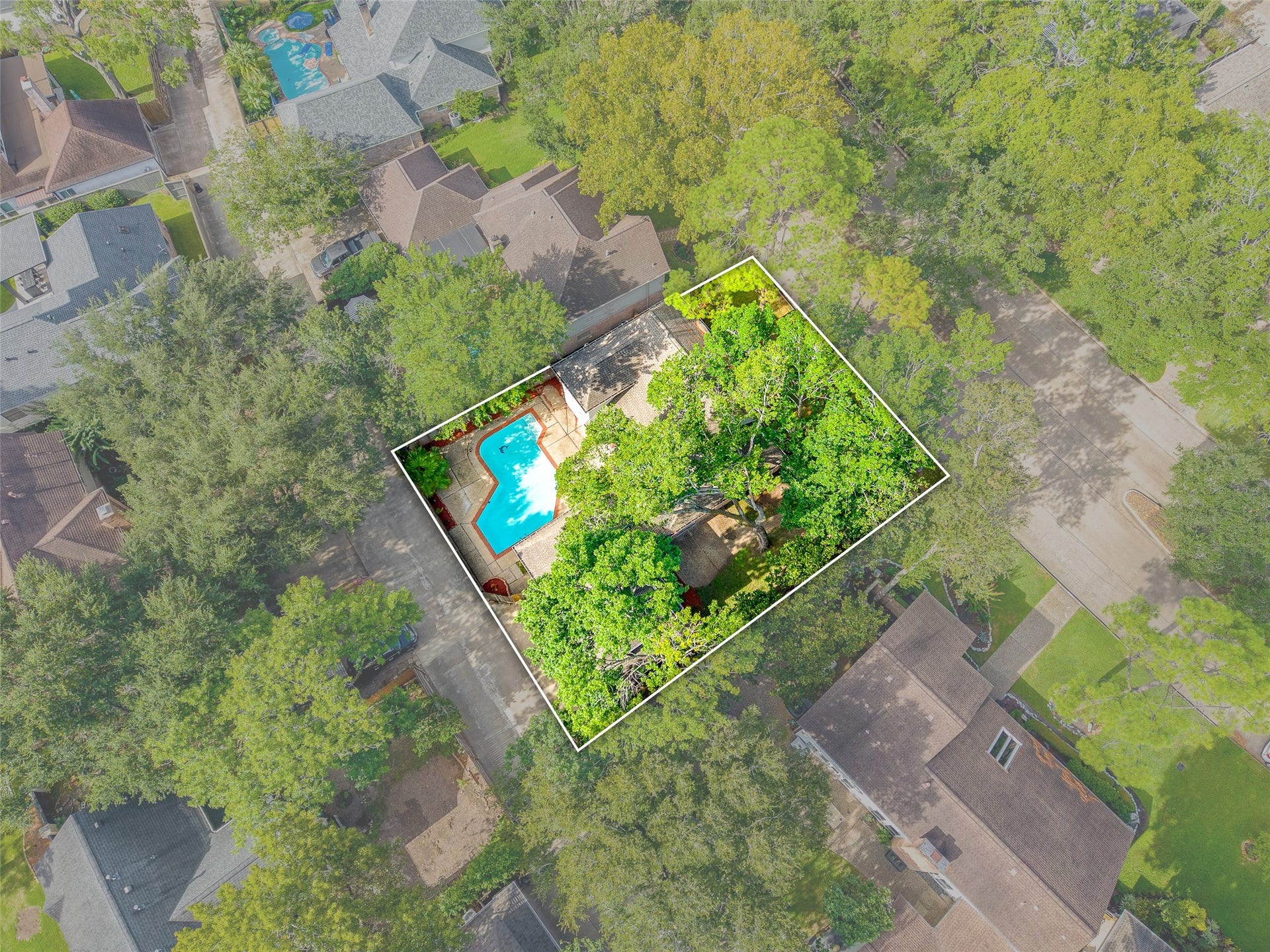 Nestled among lush greenery, this charming home boasts a private backyard oasis with a sparkling pool, perfect for relaxation and entertainment.