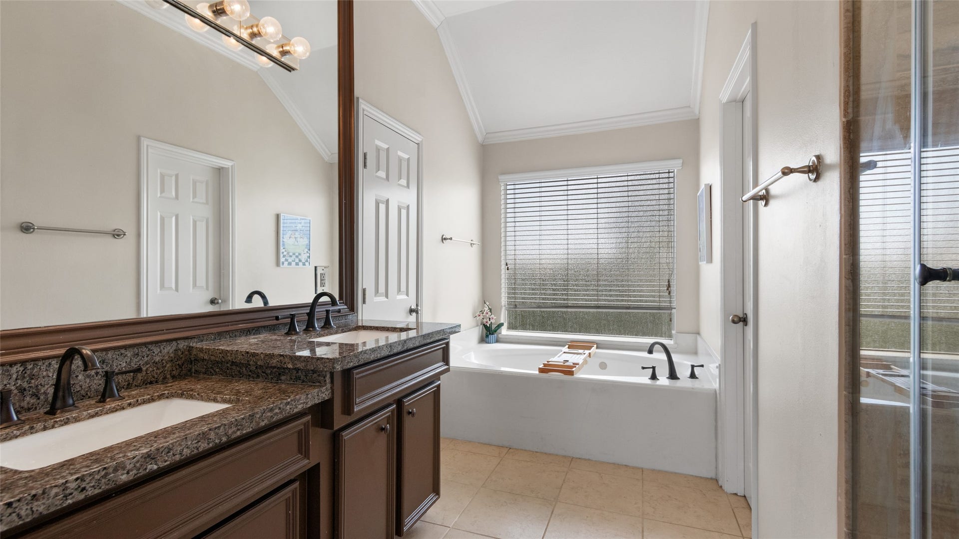 Third floor primary bath with double vanites & soaking tub