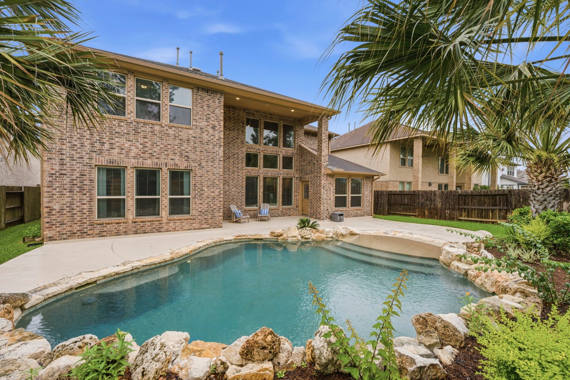 Your private backyard paradise awaits. Incredible beach-entry self-cleaning pool, expansive outdoor living space, and resort-style ambiance create the perfect setting for entertaining, relaxing, and making lasting memories.