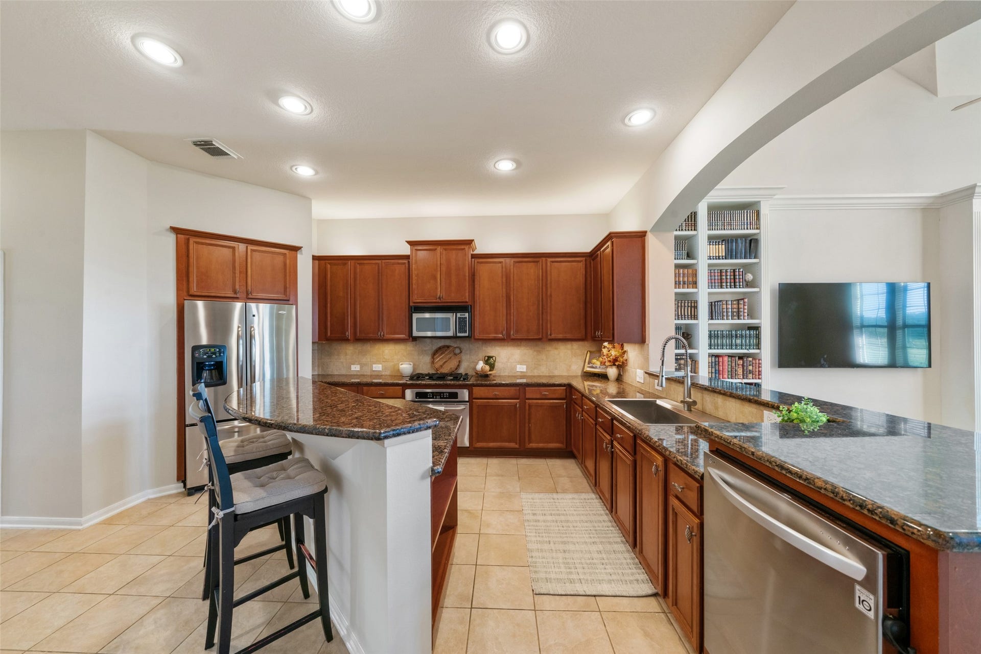 Kitchen is open to the living room, but still feels like space of its own.