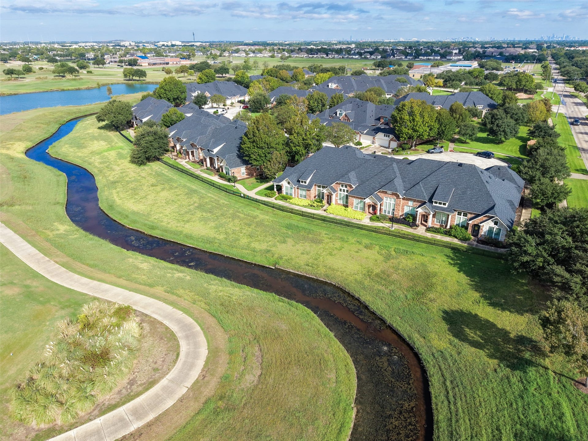 The exclusive Silverlake Townhome Community sits on the Southwyck Golf Course.  This beautiful home has a view of the canal and golf course.