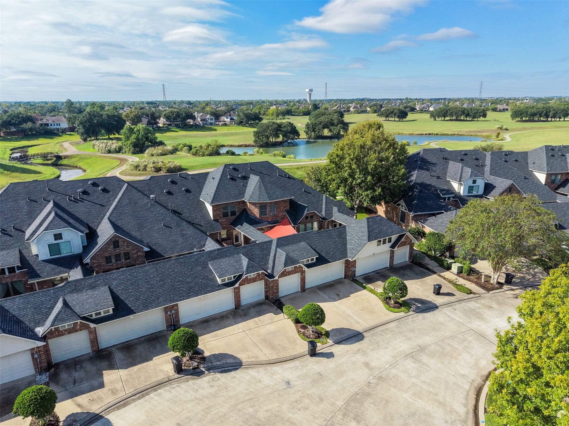Another bird's eye view of the home; the driveway and garage sit on a cul-de-sac, with the front of the home located on the golf course.  The red patio covering is 3346 Spring Landing.