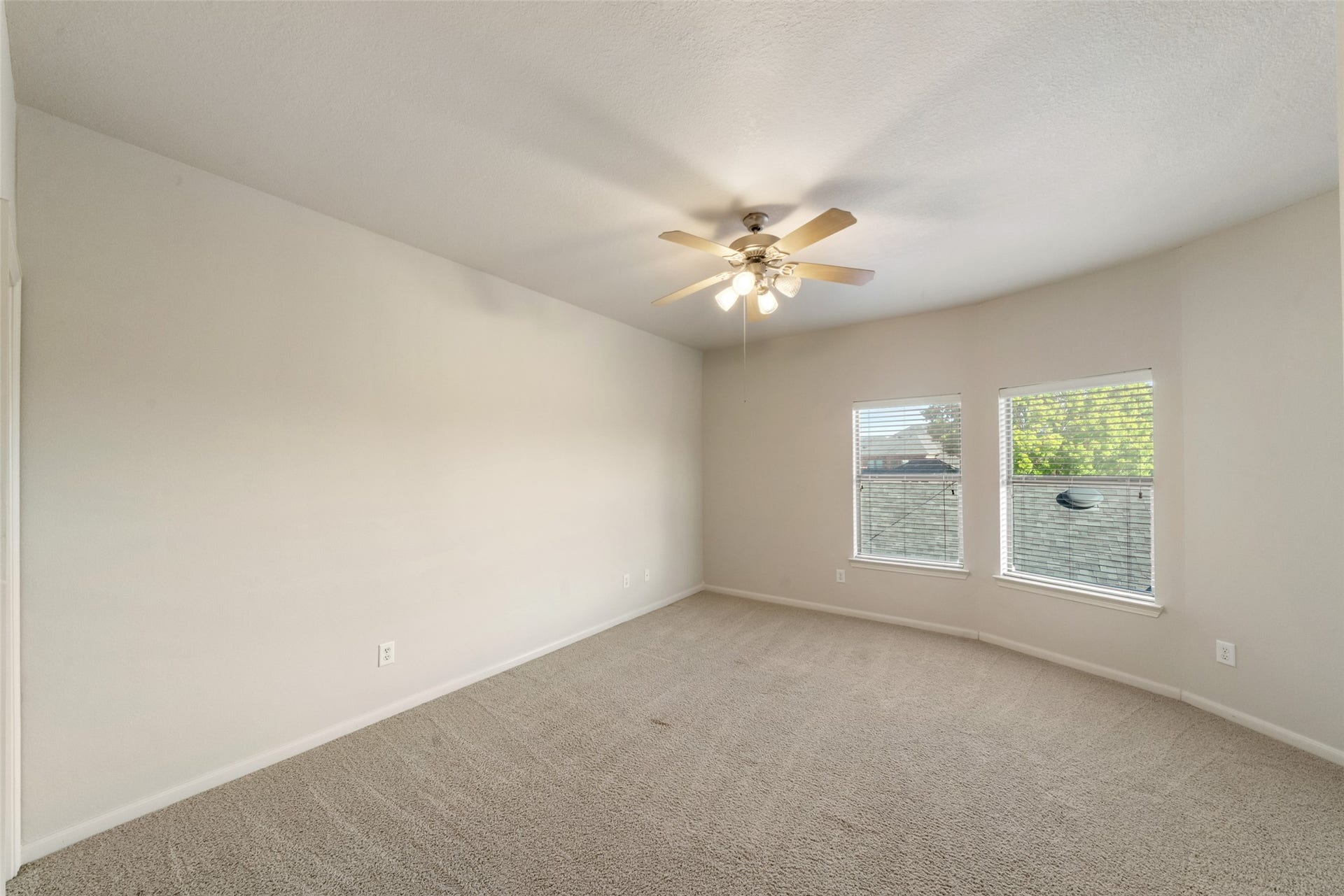 Oversized bedroom number two could easily fit another king-sized bed and includes a walk-in closet.