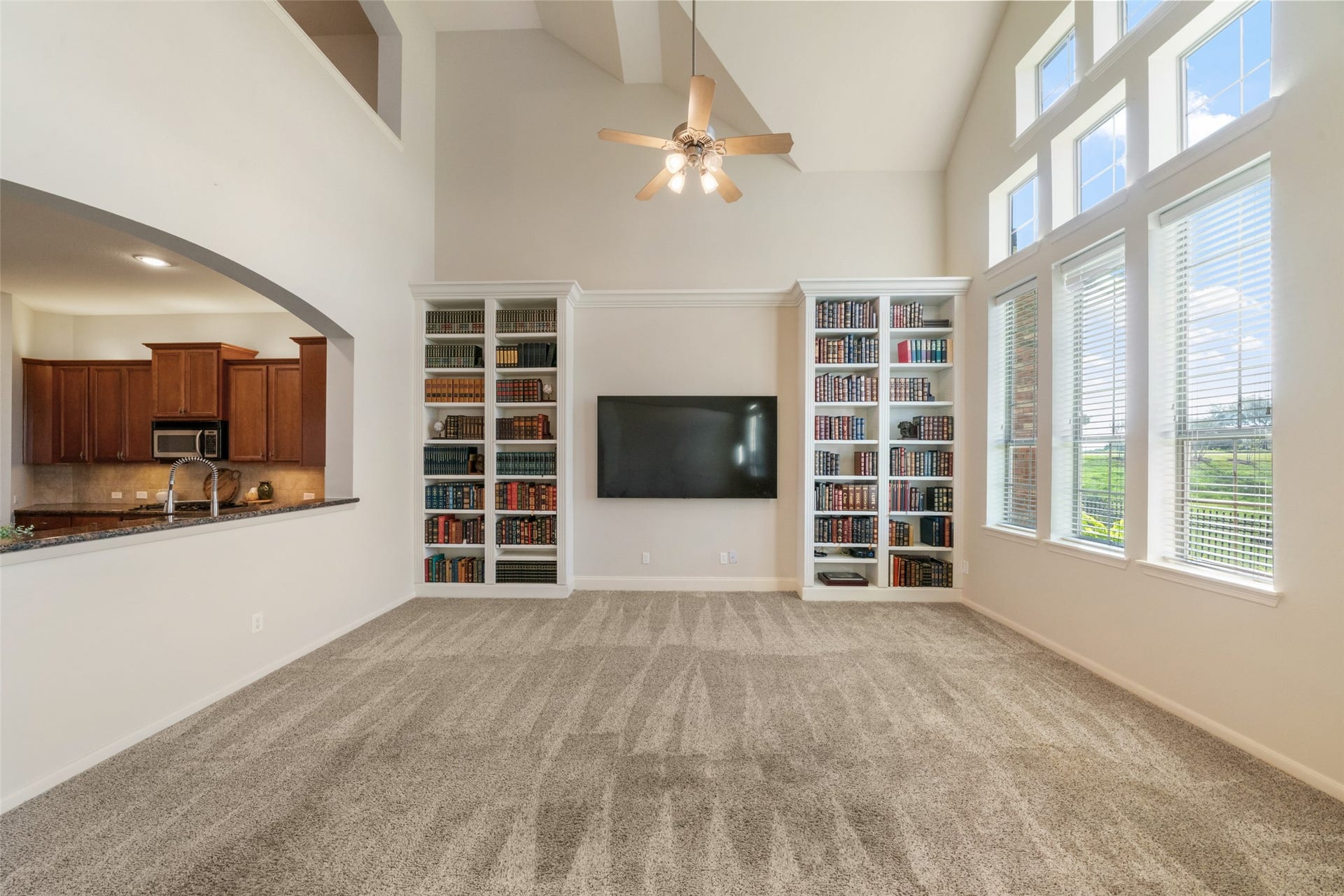 Custom built-in bookcases in this spacious living room.